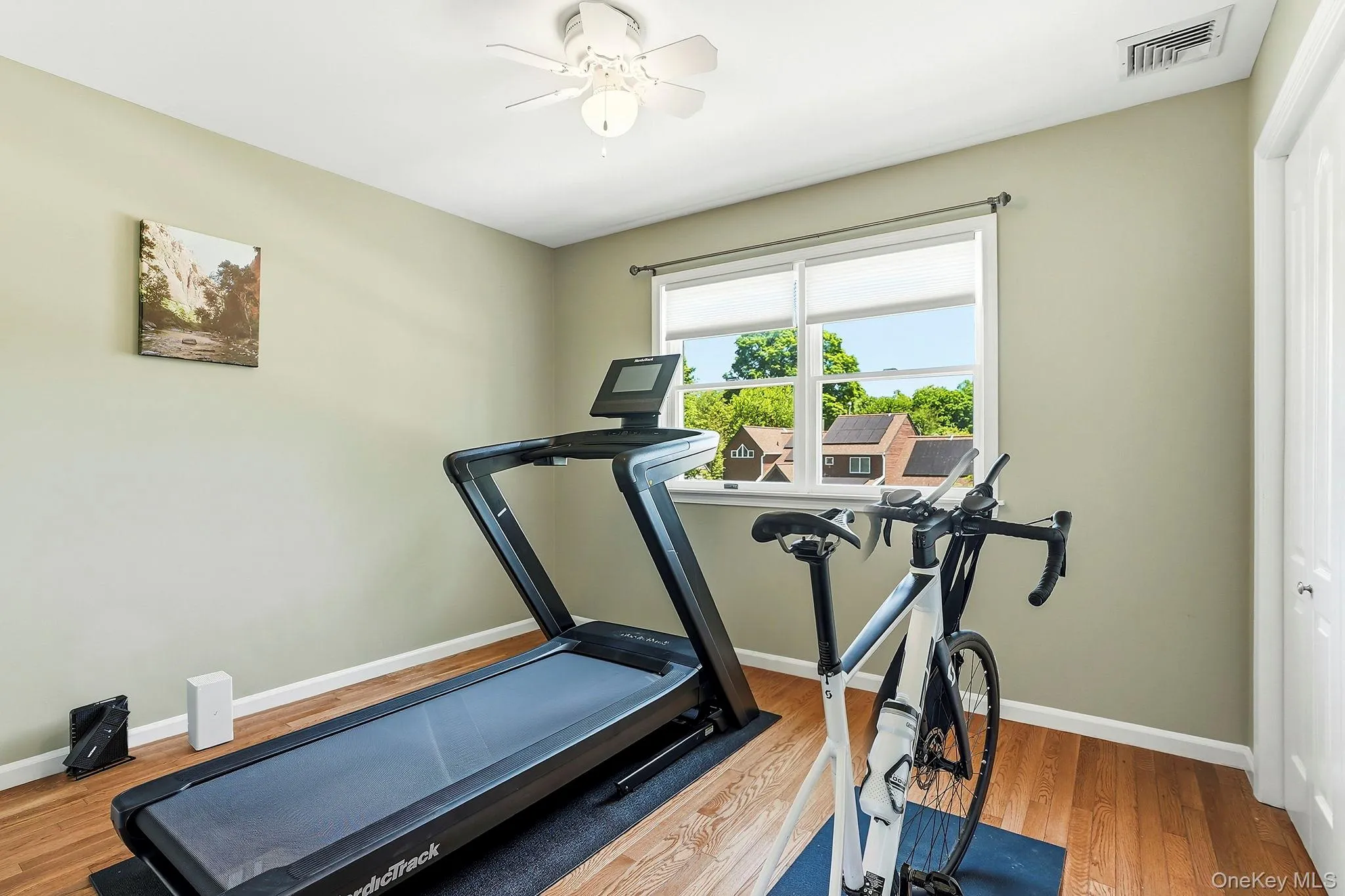 Bedroom one, front facing, is currently a home gym. Bedroom one, front facing, is currently a home gym.