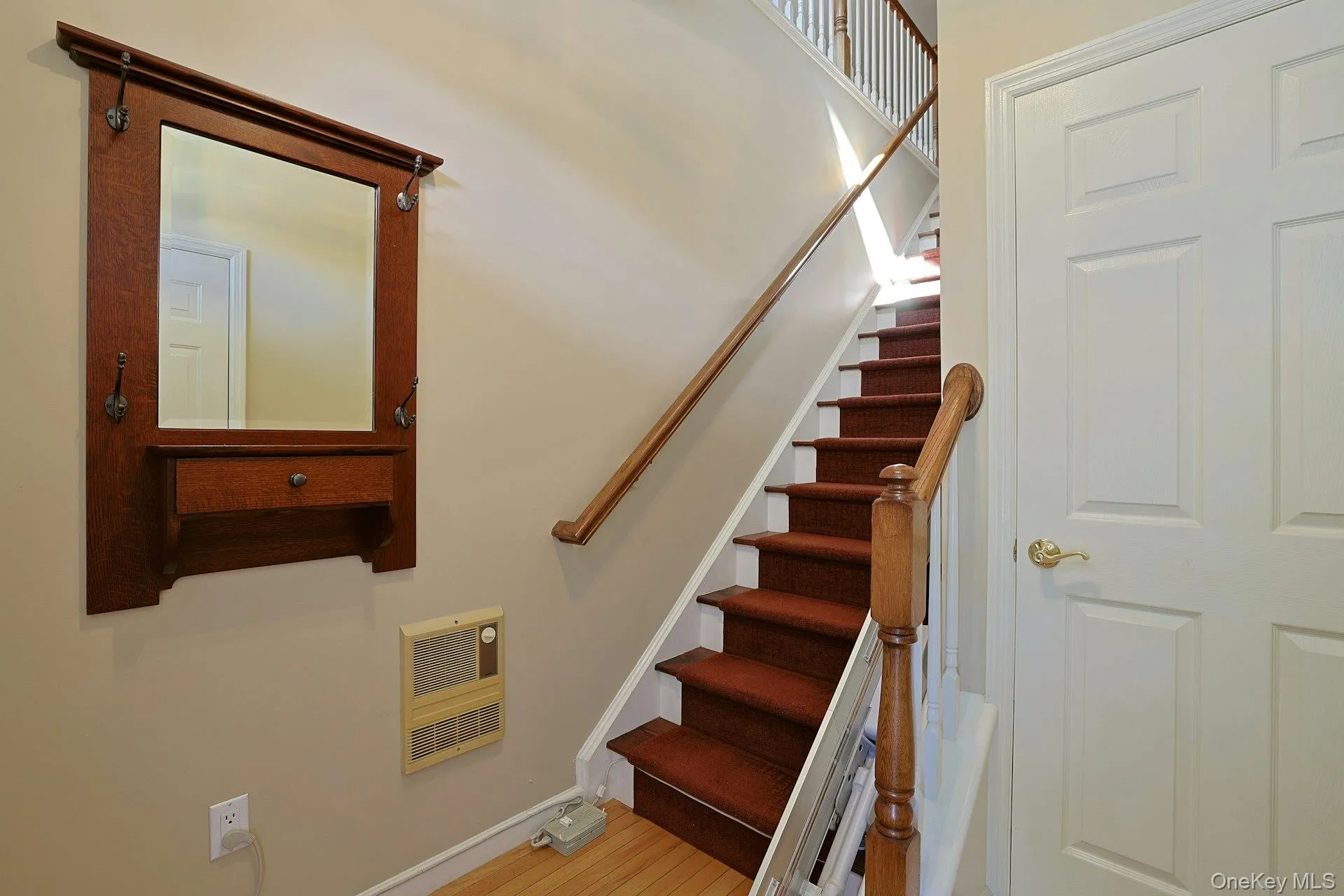 The entry staircase with stair lift adds convenience and accessibility between levels. Lift can be removed if desired. The entry staircase with stair lift adds convenience and accessibility between levels. Lift can be removed if desired.