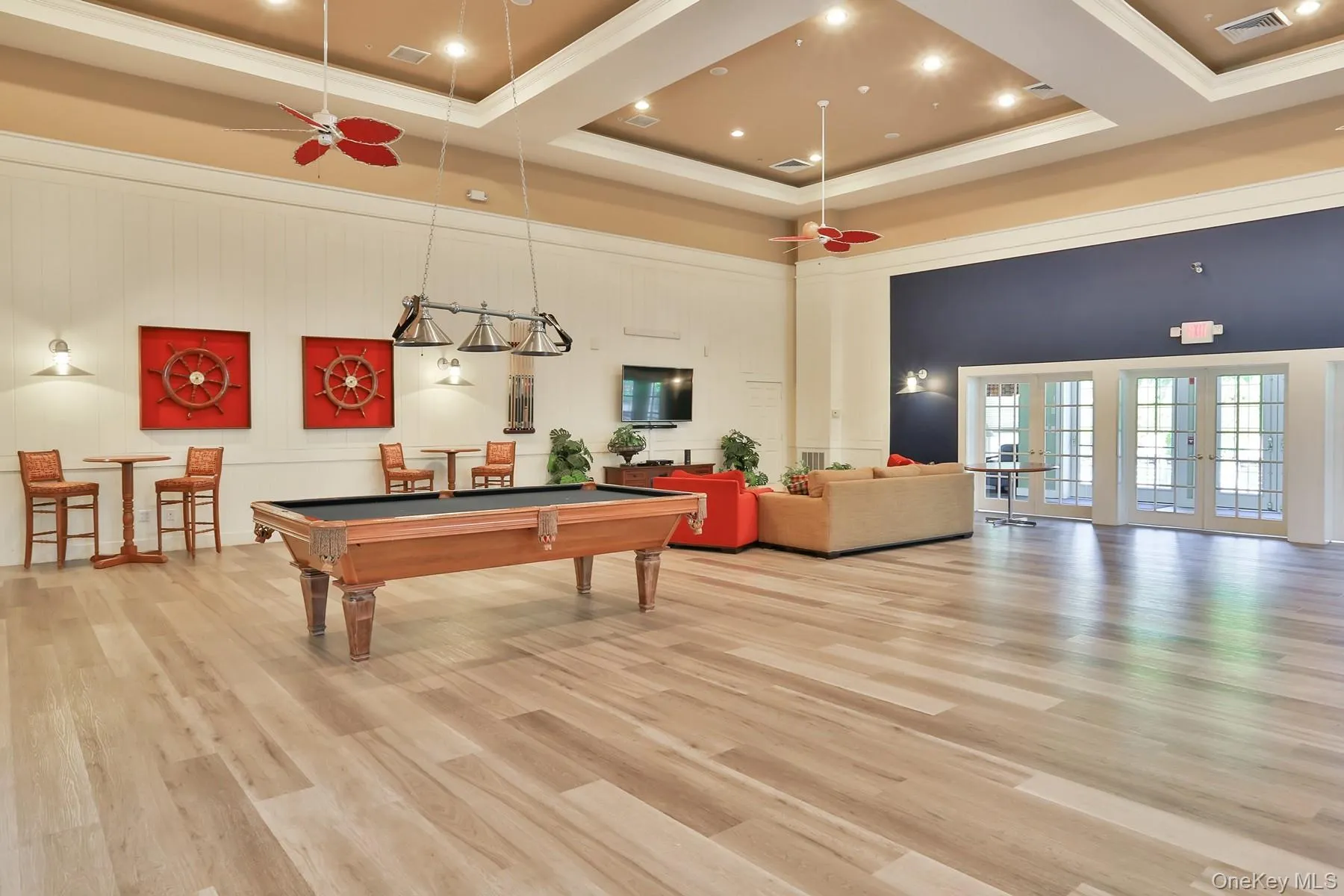 The clubhouse offers inviting amenities, including a pool table, creating a relaxed space for residents to gather and enjoy. The clubhouse offers inviting amenities, including a pool table, creating a relaxed space for residents to gather and enjoy.