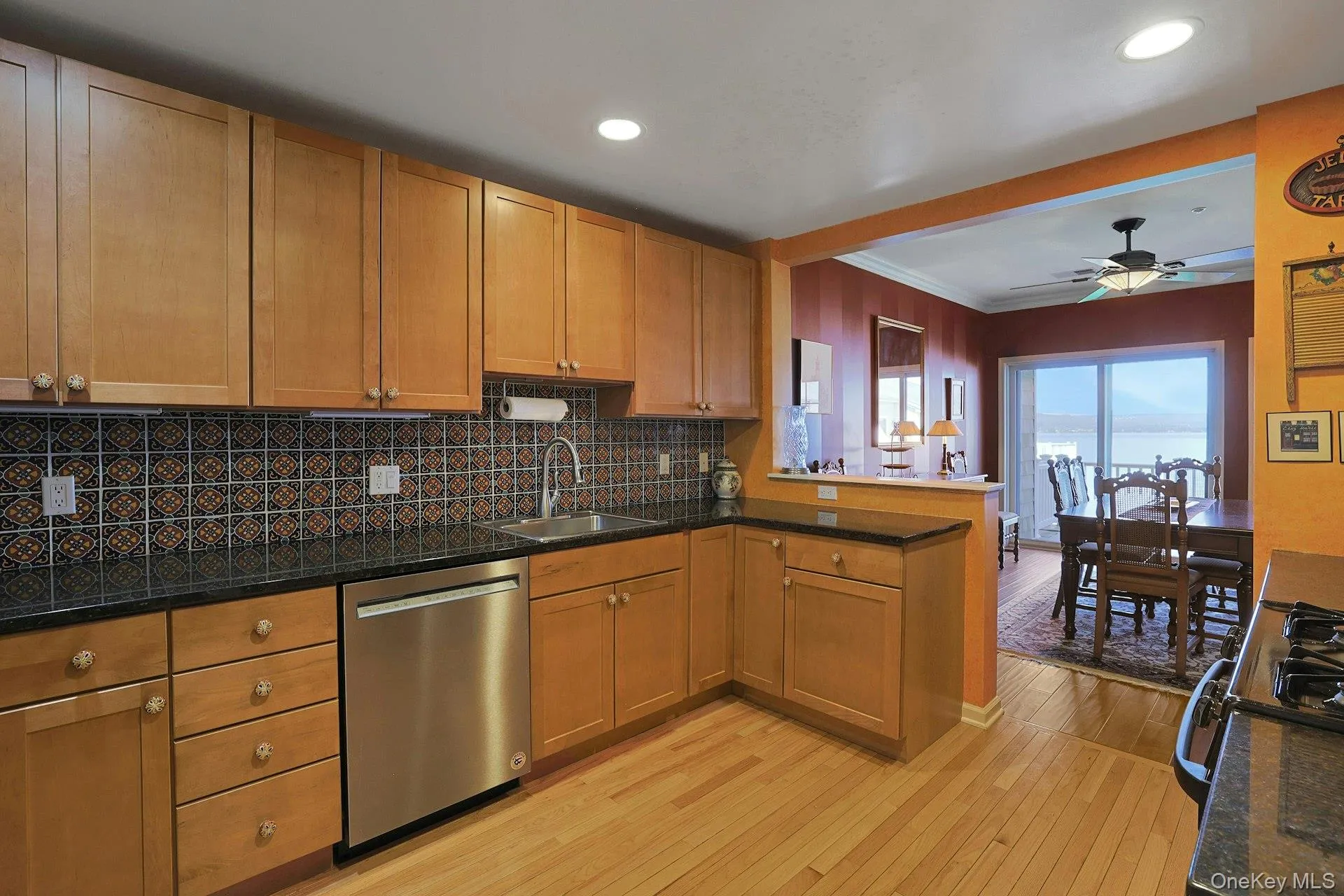 The kitchen opens to the dining room, making entertaining easy, comfortable, and convenient. The kitchen opens to the dining room, making entertaining easy, comfortable, and convenient.