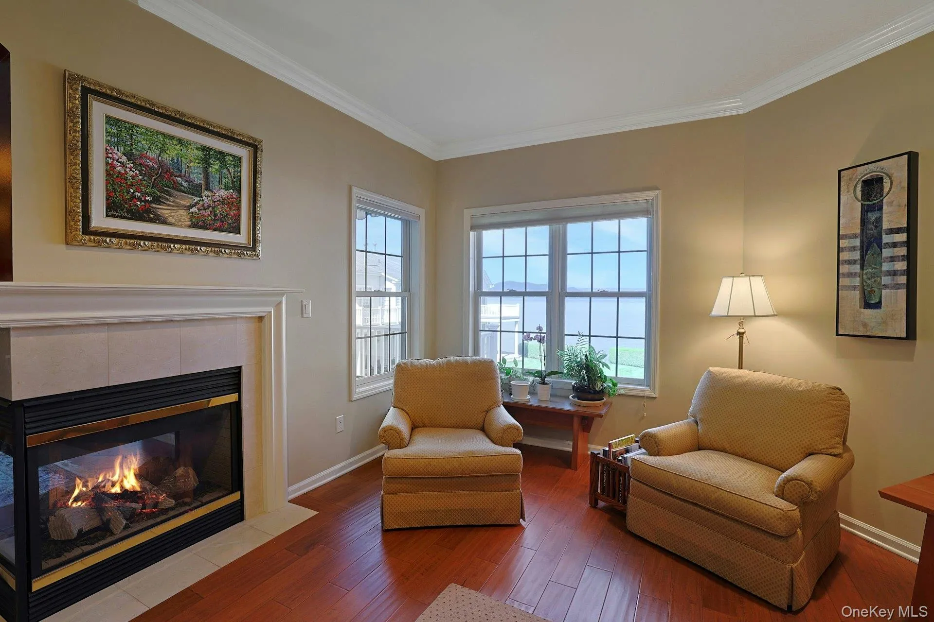 A comfortable place to sit by the fireplace while taking in the beautiful view. A comfortable place to sit by the fireplace while taking in the beautiful view.