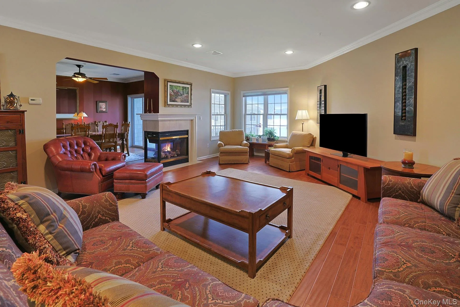 A three sided gas fireplace shared between the living and dining rooms adds charm, actual warmth, and a lovely additional focal point to the main living spaces. A three sided gas fireplace shared between the living and dining rooms adds charm, actual warmth, and a lovely additional focal point to the main living spaces.