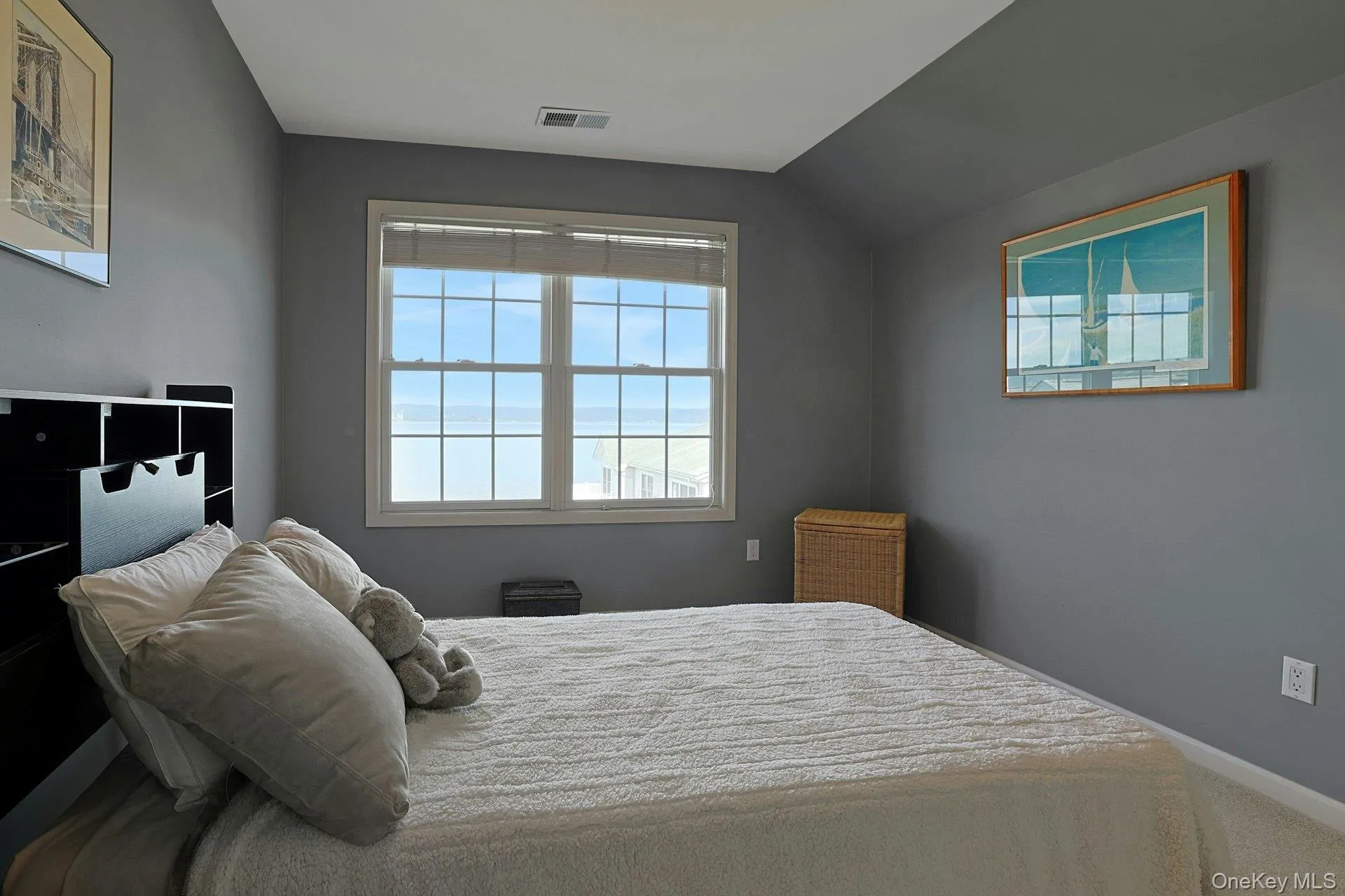 The third bedroom also offers a beautiful view of the Hudson River, adding light, scenery, and a peaceful feel to the space. The third bedroom also offers a beautiful view of the Hudson River, adding light, scenery, and a peaceful feel to the space.