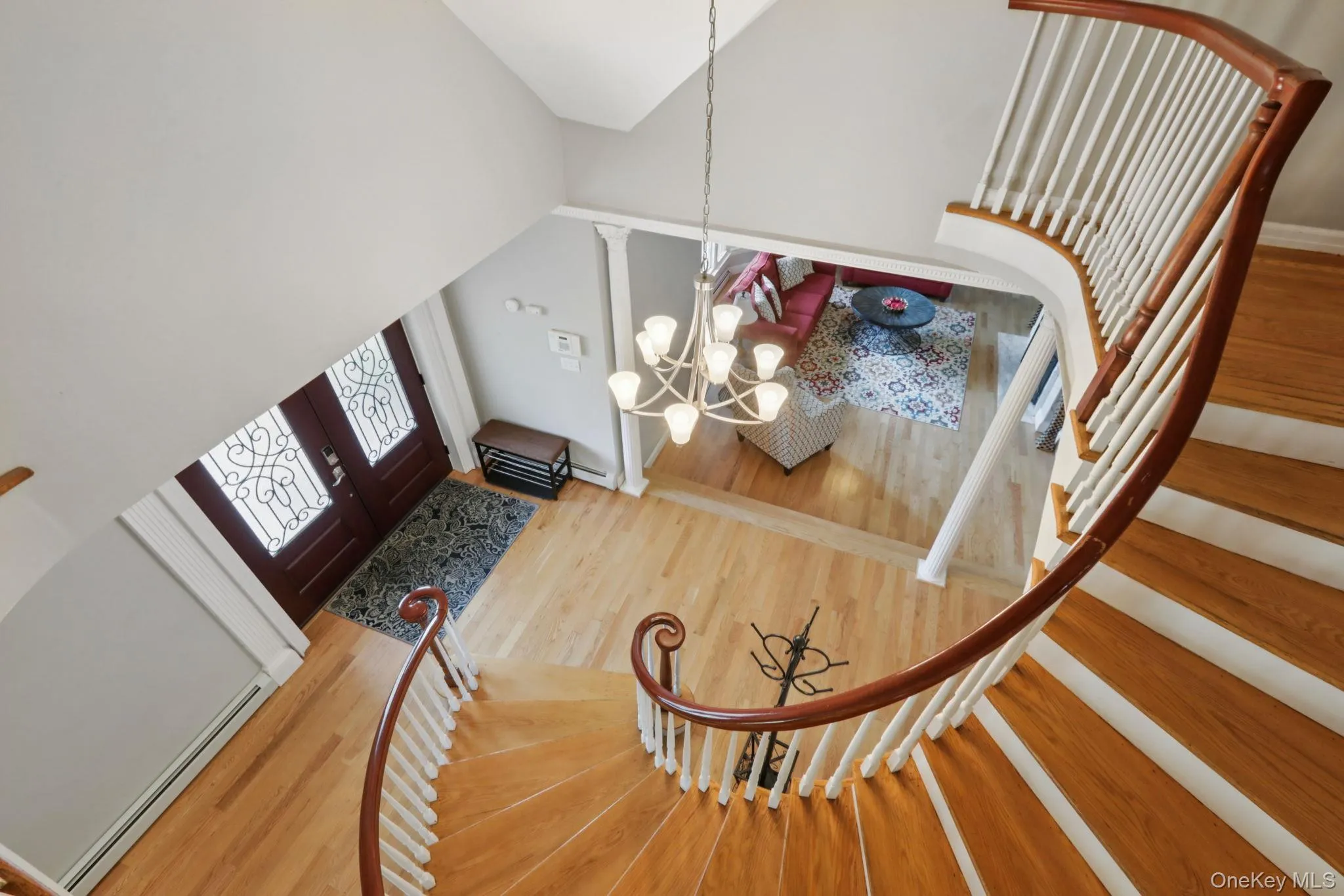 View of sweeping staircase from upstairs foyer View of sweeping staircase from upstairs foyer