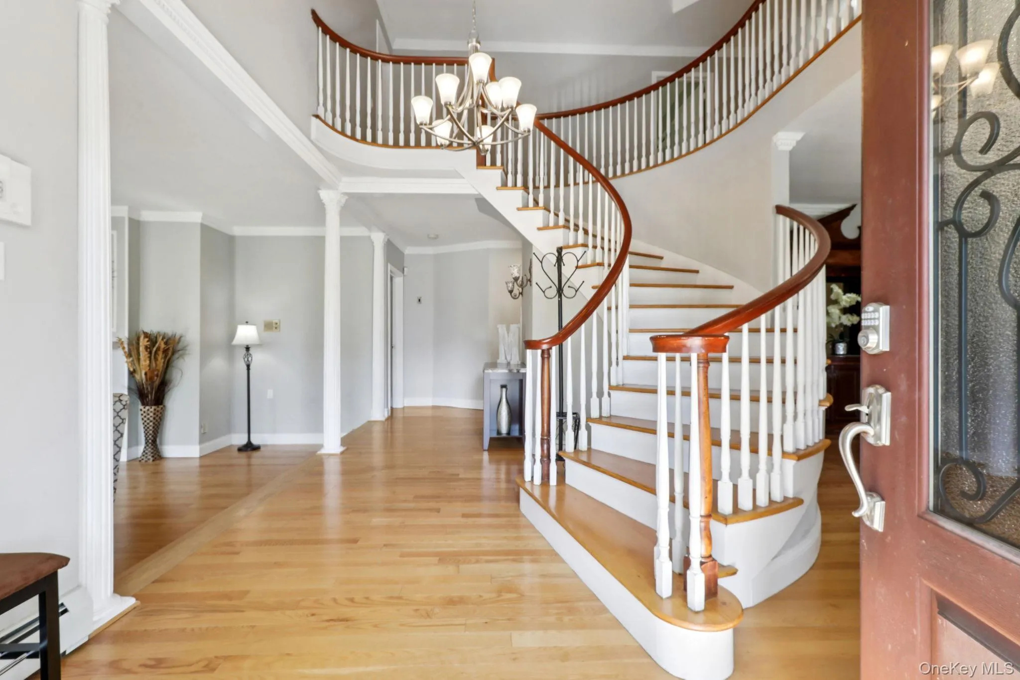 Gracious entry foyer with a spiral staircase to steal the show Gracious entry foyer with a spiral staircase to steal the show