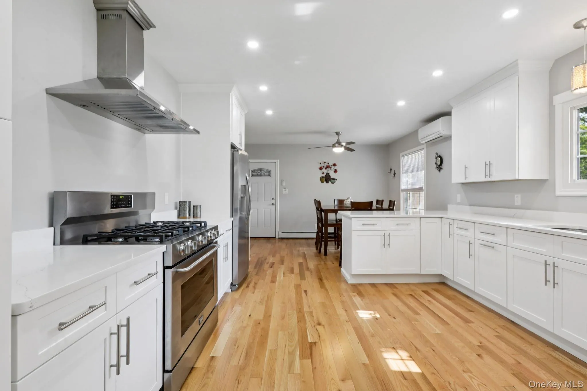 The updated kitchen offers timeless white Quartz countertops and plenty of cabinetry The updated kitchen offers timeless white Quartz countertops and plenty of cabinetry