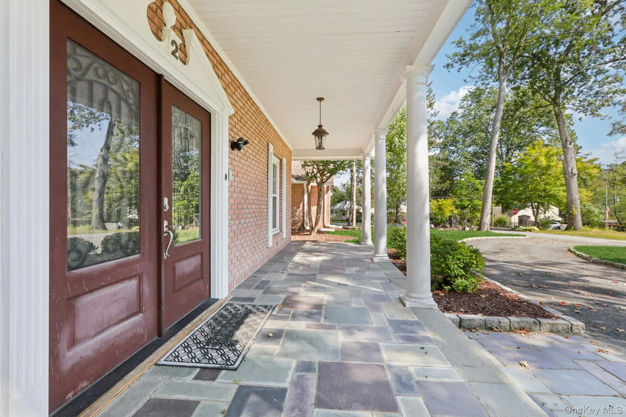 Slate front porch welcomes your guests Slate front porch welcomes your guests