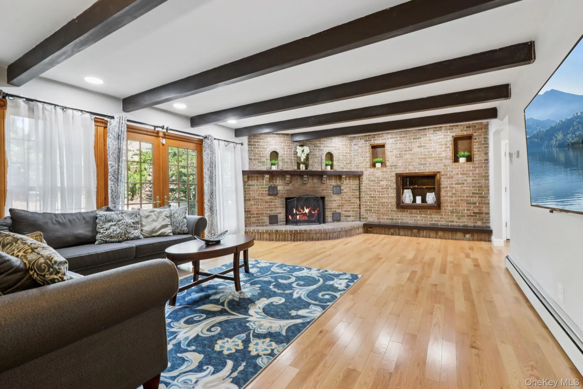 Naturally lit family rom with french door leading to slate patio for ease of mixing and mingling. Naturally lit family rom with french door leading to slate patio for ease of mixing and mingling.