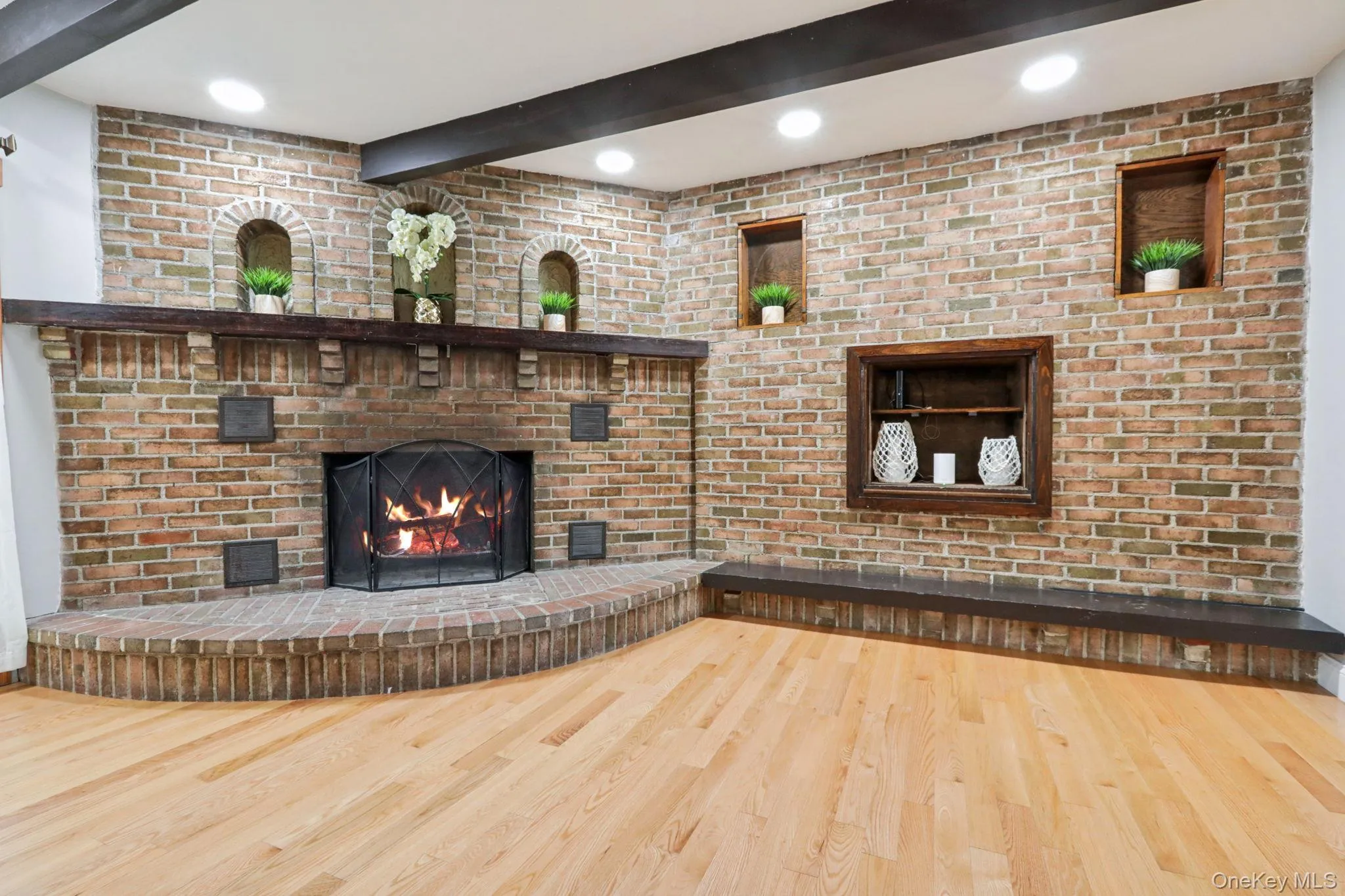 As you enter into the family room, you cannot help but notice this beautiful fireplace with brick surround. (flame in fireplace staged) As you enter into the family room, you cannot help but notice this beautiful fireplace with brick surround. (flame in fireplace staged)