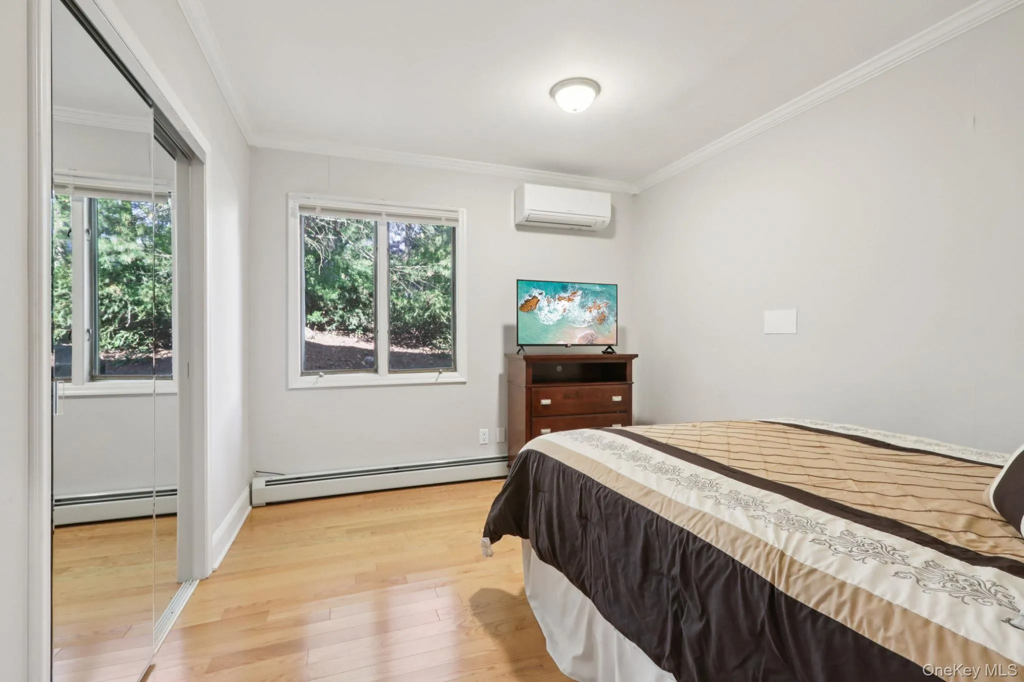 First floor bedroom with wood floors and large closet First floor bedroom with wood floors and large closet