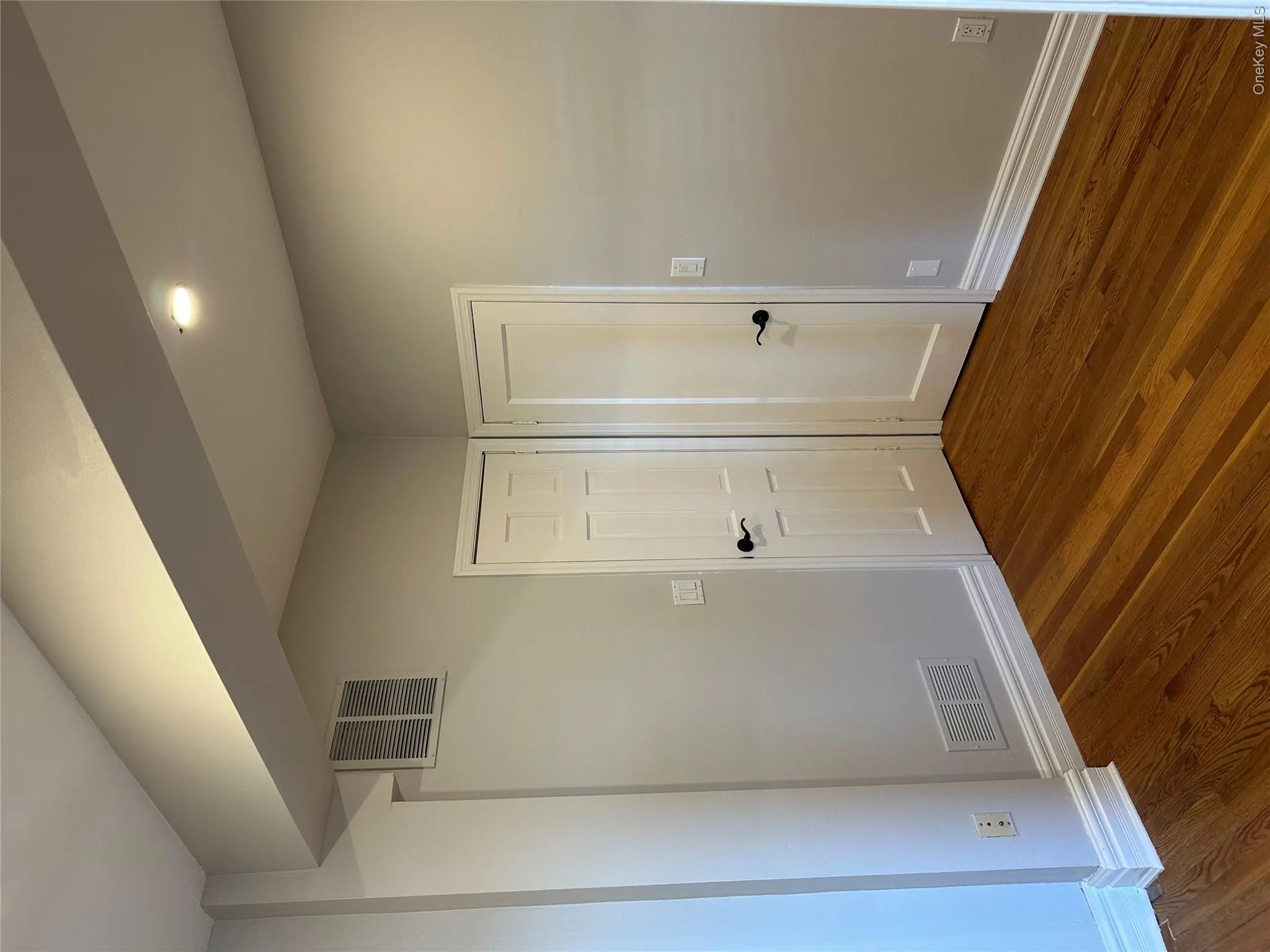 Spare room featuring baseboards, visible vents, recessed lighting, and dark wood-style flooring Spare room featuring baseboards, visible vents, recessed lighting, and dark wood-style flooring