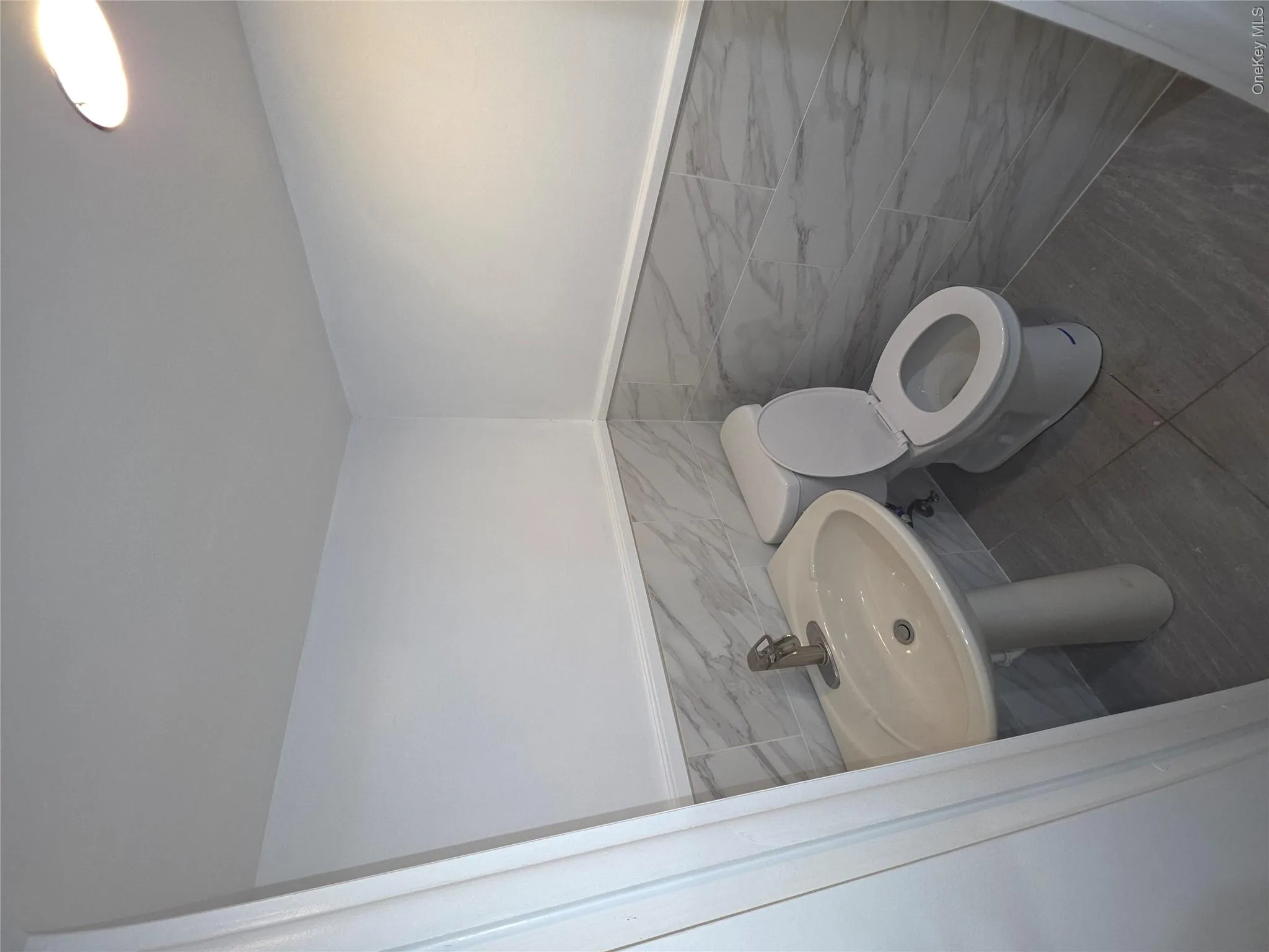 Pedestal sink with a single-handle faucet Pedestal sink with a single-handle faucet