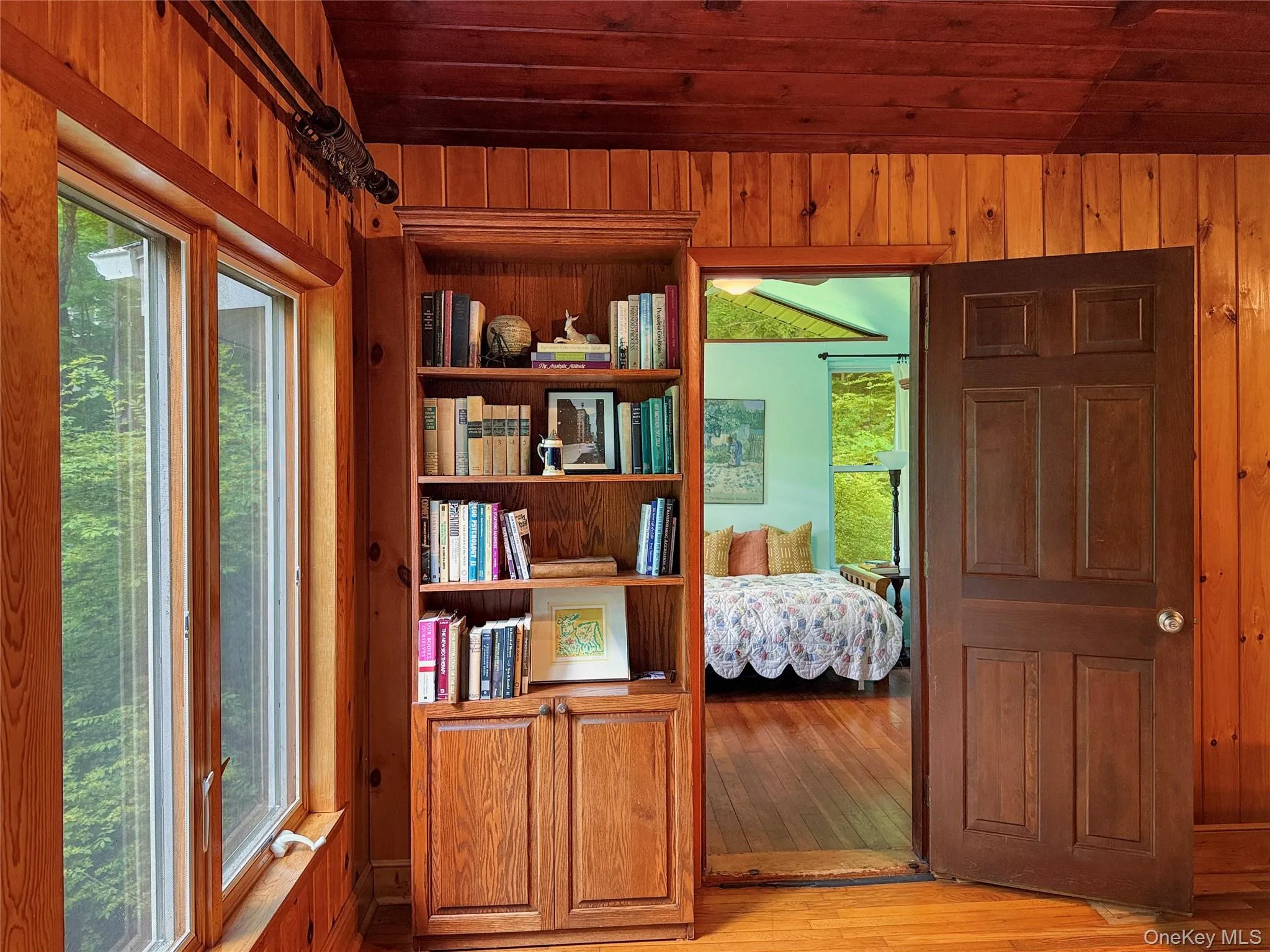 Large windows with lake views and access to second bedroom Large windows with lake views and access to second bedroom