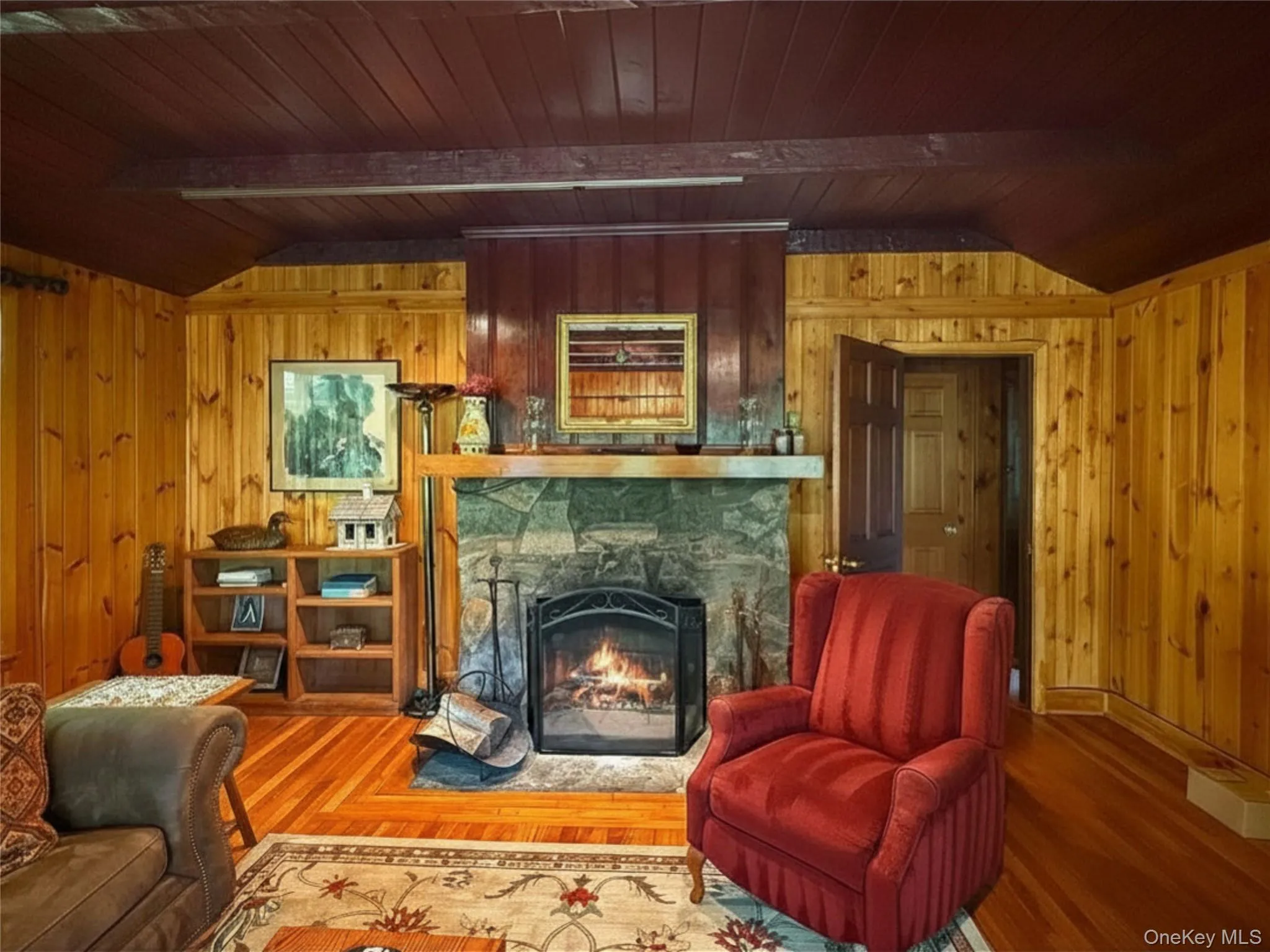 Wood burning stone fireplace with access to primary bedroom and full bath Wood burning stone fireplace with access to primary bedroom and full bath
