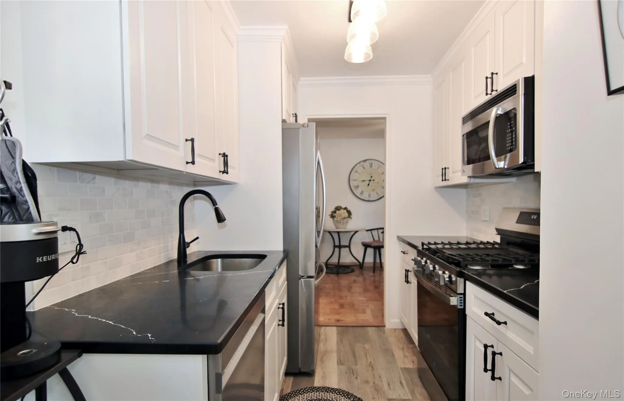 Kitchen with White Cabinetry and Granite Countertops Kitchen with White Cabinetry and Granite Countertops
