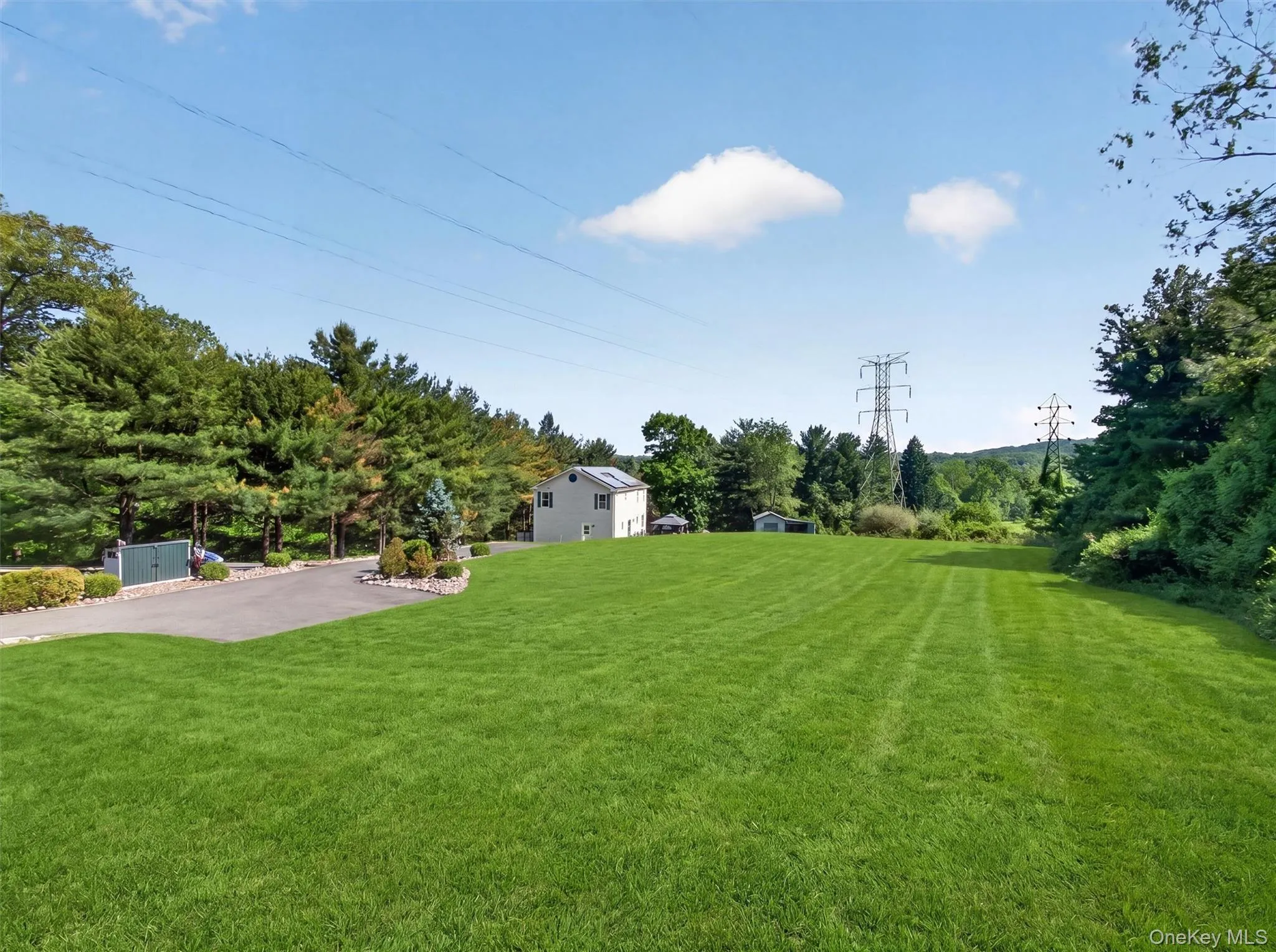 Expansive backyard featuring open green space, mature surroundings, and endless possibilities for outdoor enjoyment. Expansive backyard featuring open green space, mature surroundings, and endless possibilities for outdoor enjoyment.