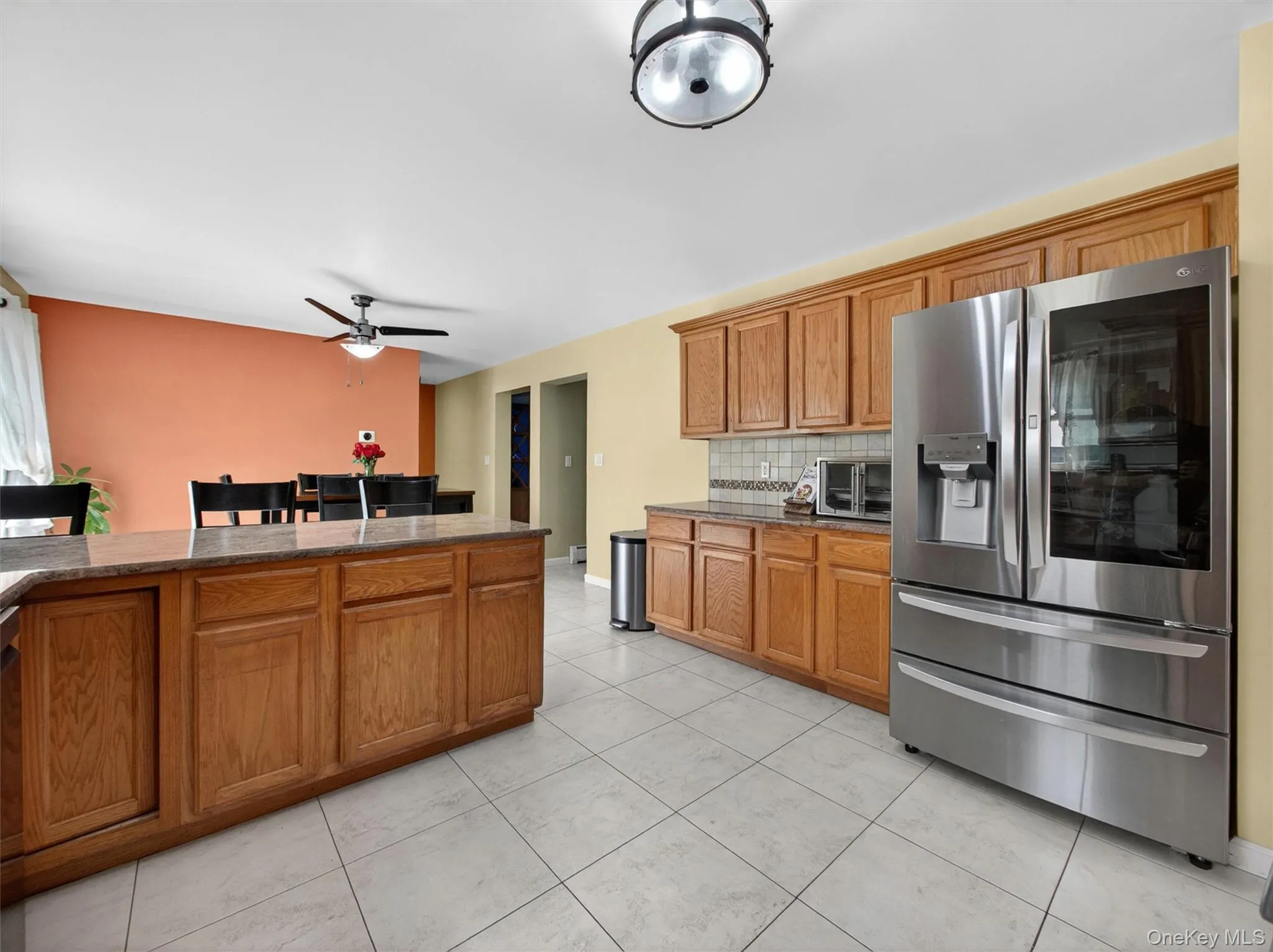 Bright and functional kitchen offering casual seating, generous storage, and a welcoming gathering space. Bright and functional kitchen offering casual seating, generous storage, and a welcoming gathering space.