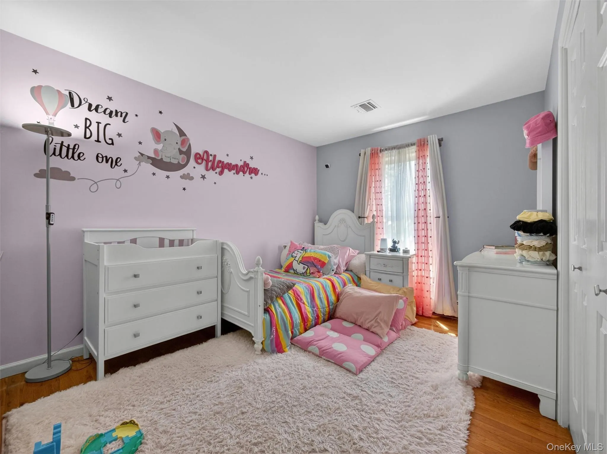 Bedroom Three - Charming bedroom featuring hardwood floors, natural light, and a warm inviting atmosphere. Bedroom Three - Charming bedroom featuring hardwood floors, natural light, and a warm inviting atmosphere.