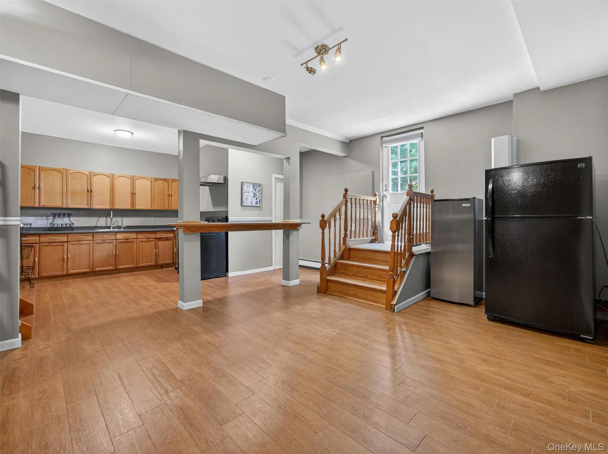 Bright lower-level gathering area offering versatile space for entertaining, recreation, hobbies, or extended living needs. Bright lower-level gathering area offering versatile space for entertaining, recreation, hobbies, or extended living needs.