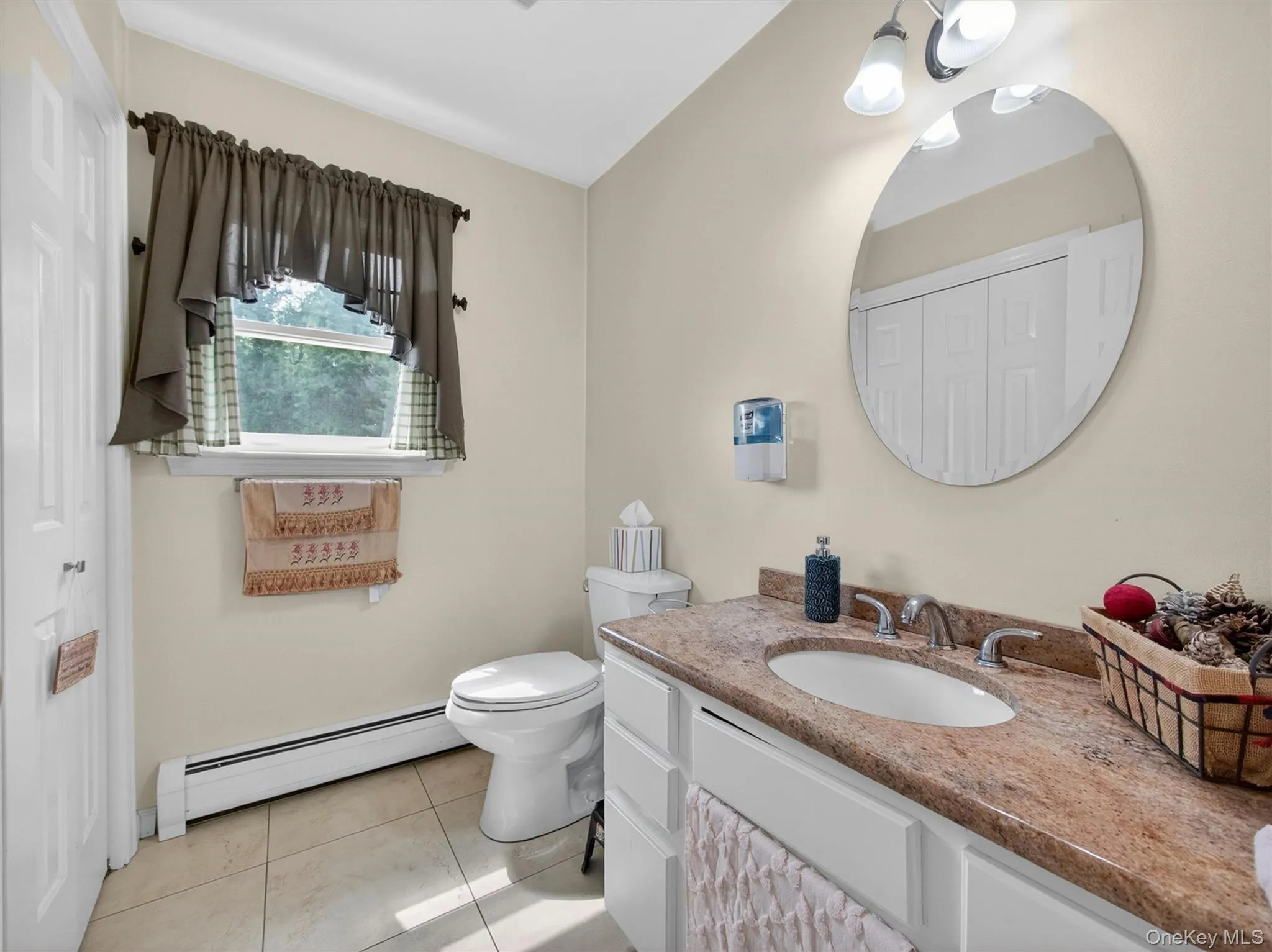 Convenient first-floor half bathroom featuring a functional layout and easy access from the main living areas. Convenient first-floor half bathroom featuring a functional layout and easy access from the main living areas.