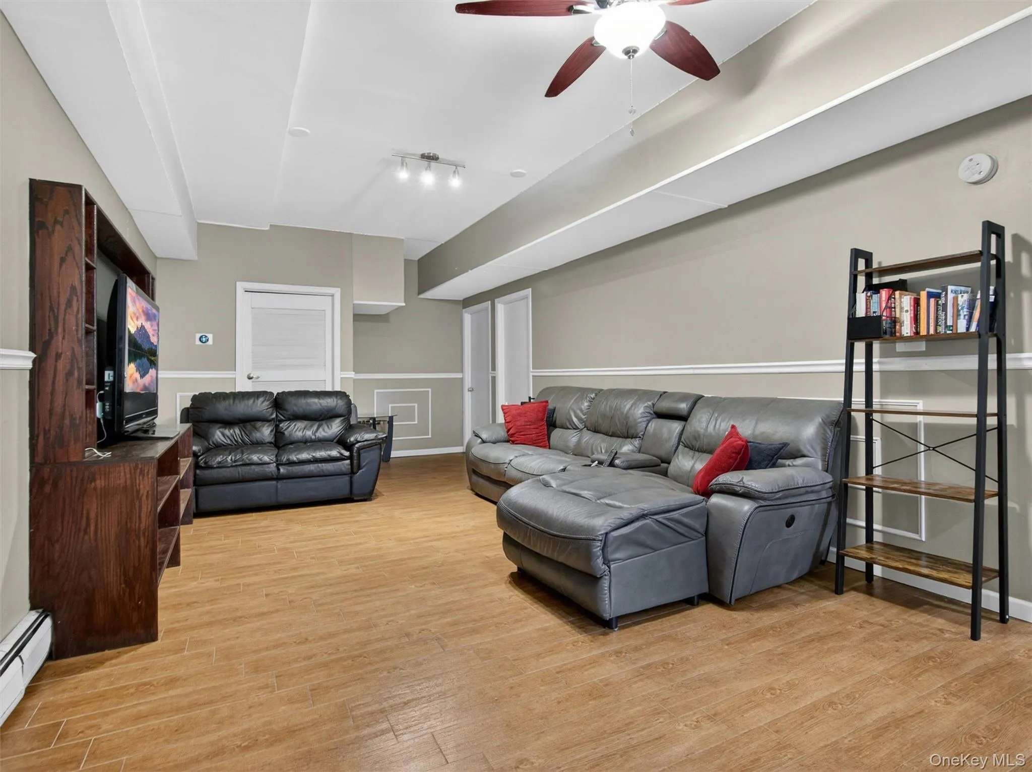 Large lower-level bonus area offering flexible space for a media room, playroom, gym, office, or hobbies. Large lower-level bonus area offering flexible space for a media room, playroom, gym, office, or hobbies.