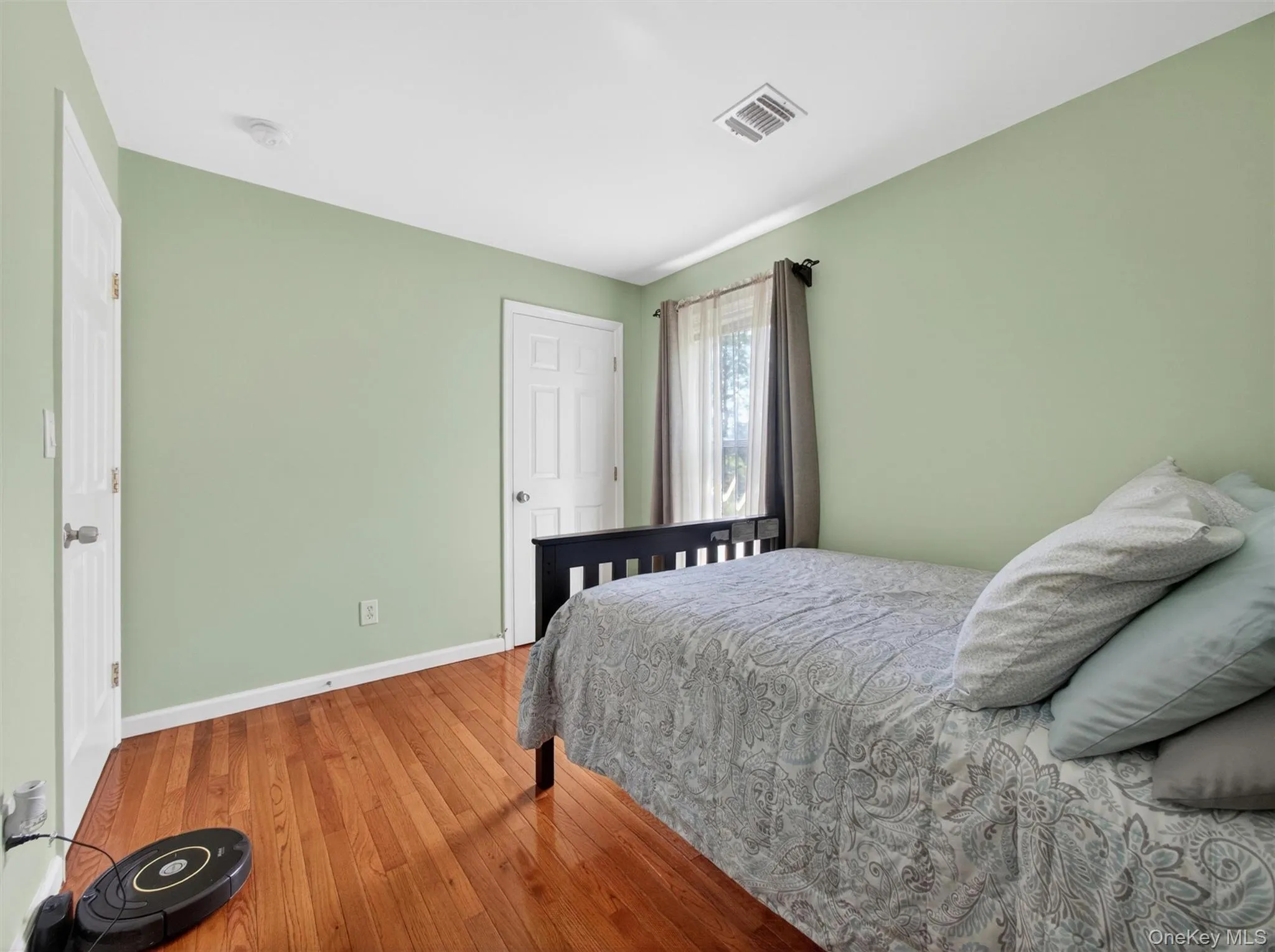 Bedroom Four – Bright bedroom featuring hardwood floors, large windows, and a comfortable layout Bedroom Four – Bright bedroom featuring hardwood floors, large windows, and a comfortable layout