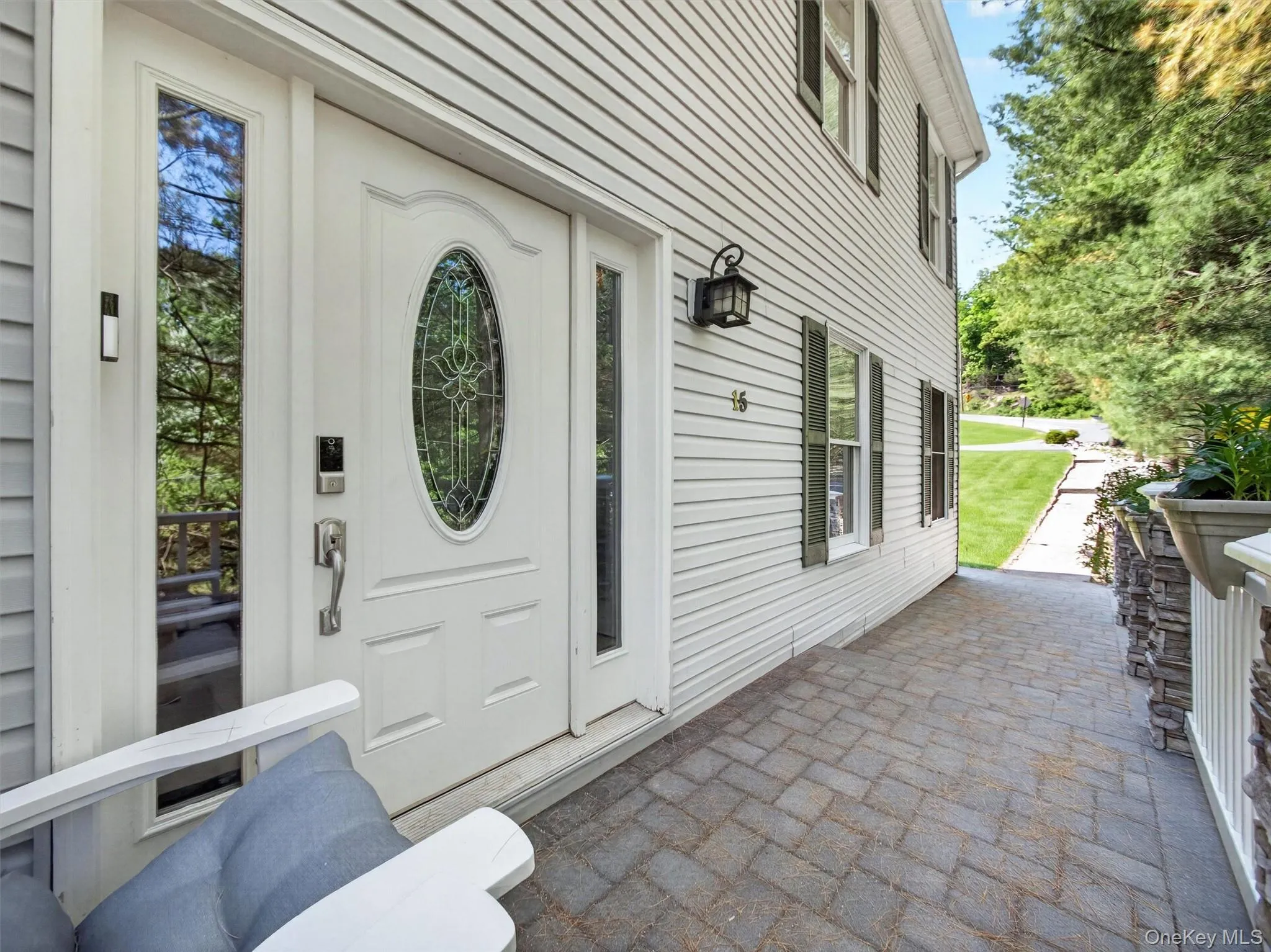 Welcoming front entry with paver walkway and inviting covered entrance. Welcoming front entry with paver walkway and inviting covered entrance.