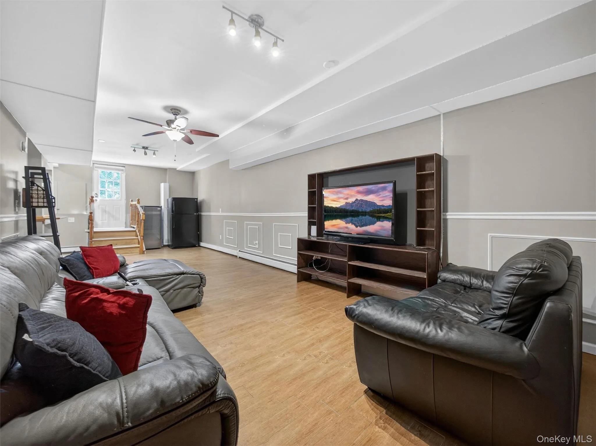 Spacious lower-level gathering area with an open layout and multiple possibilities for recreation or extended living space. Spacious lower-level gathering area with an open layout and multiple possibilities for recreation or extended living space.