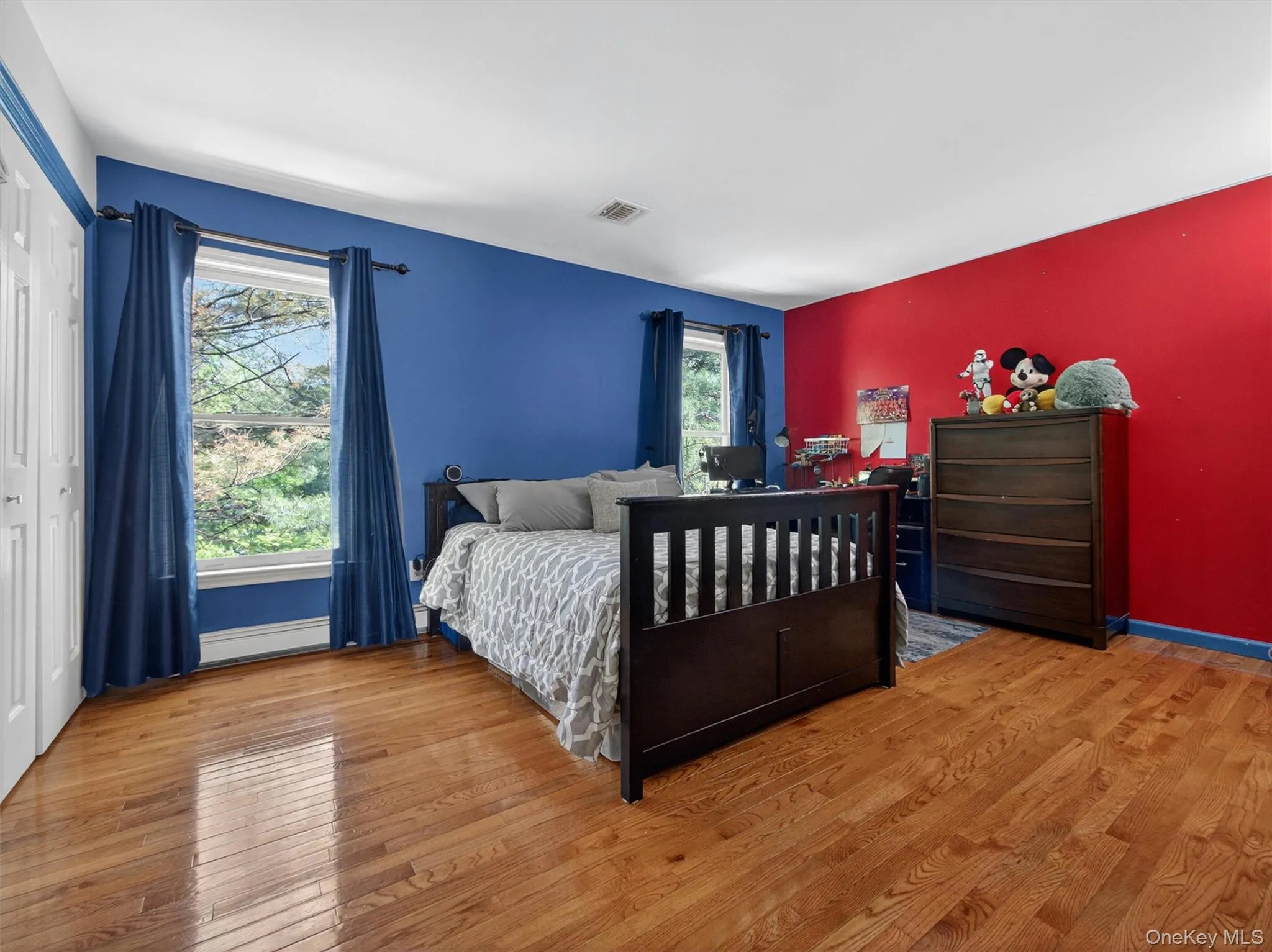 Bedroom Two –Spacious bedroom featuring hardwood floors, large windows, and abundant natural light. Bedroom Two –Spacious bedroom featuring hardwood floors, large windows, and abundant natural light.