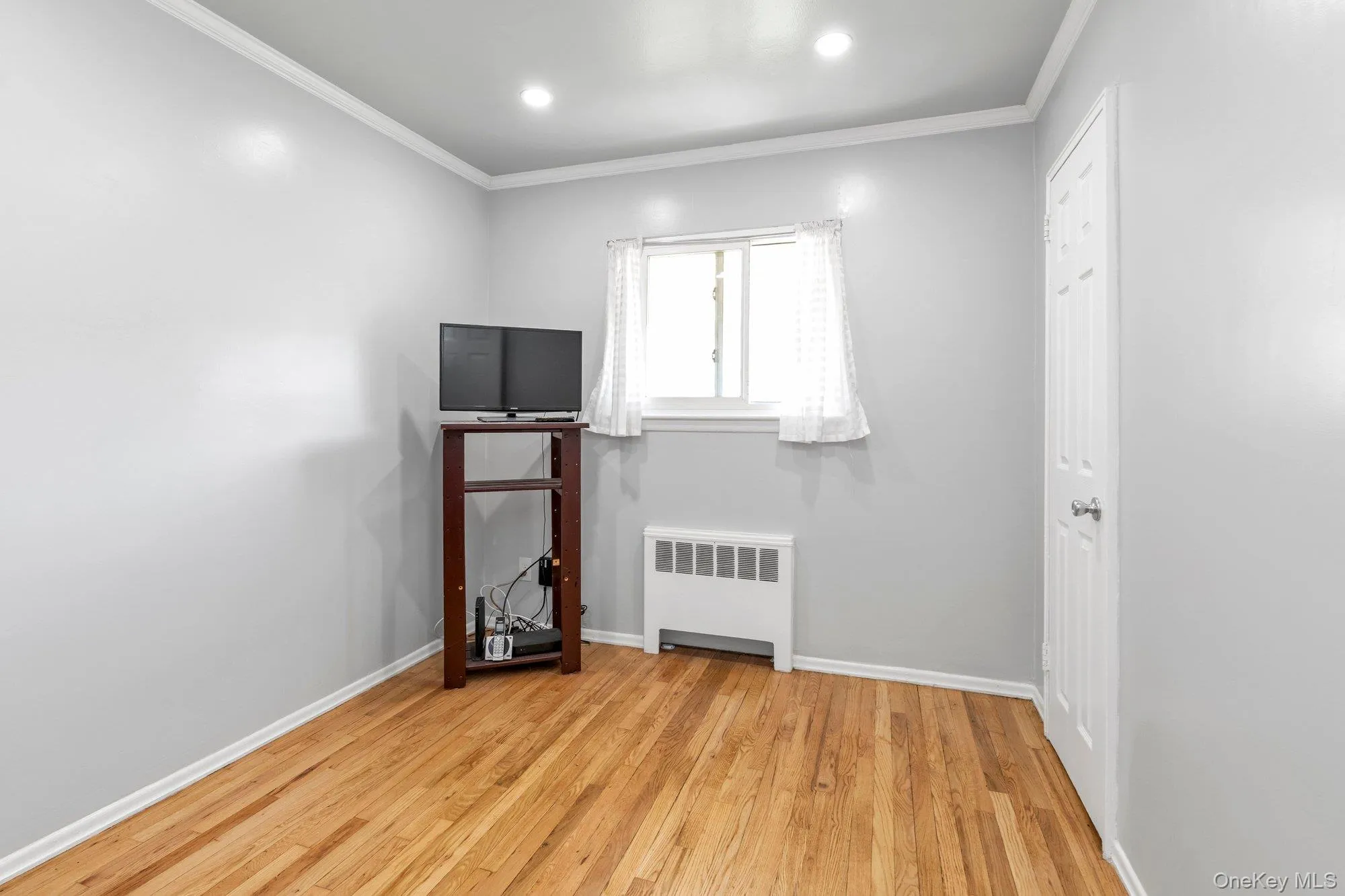 Third bedroom with hardwood floors Third bedroom with hardwood floors