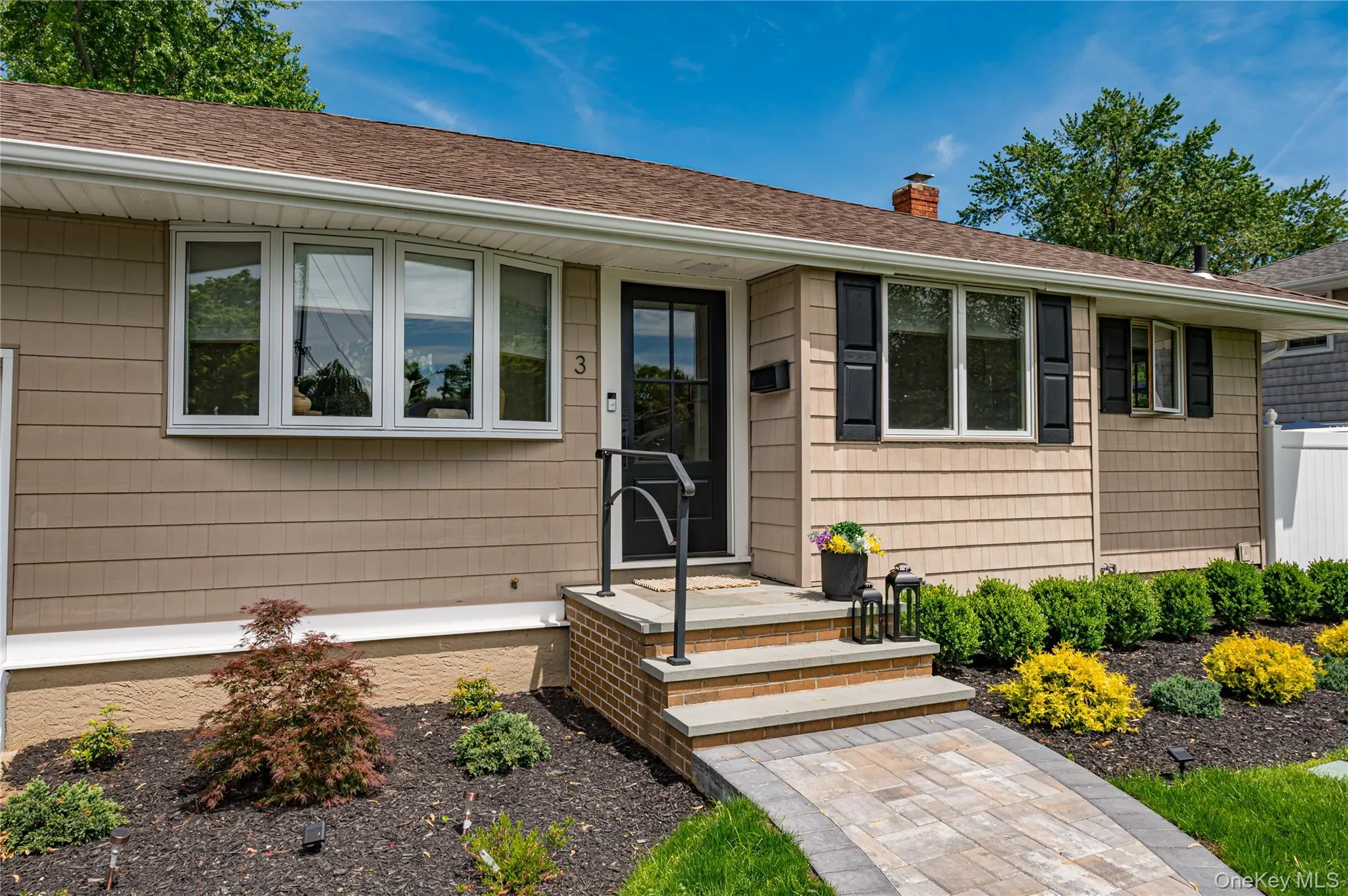 with new landscaping and new paver walkway with new landscaping and new paver walkway