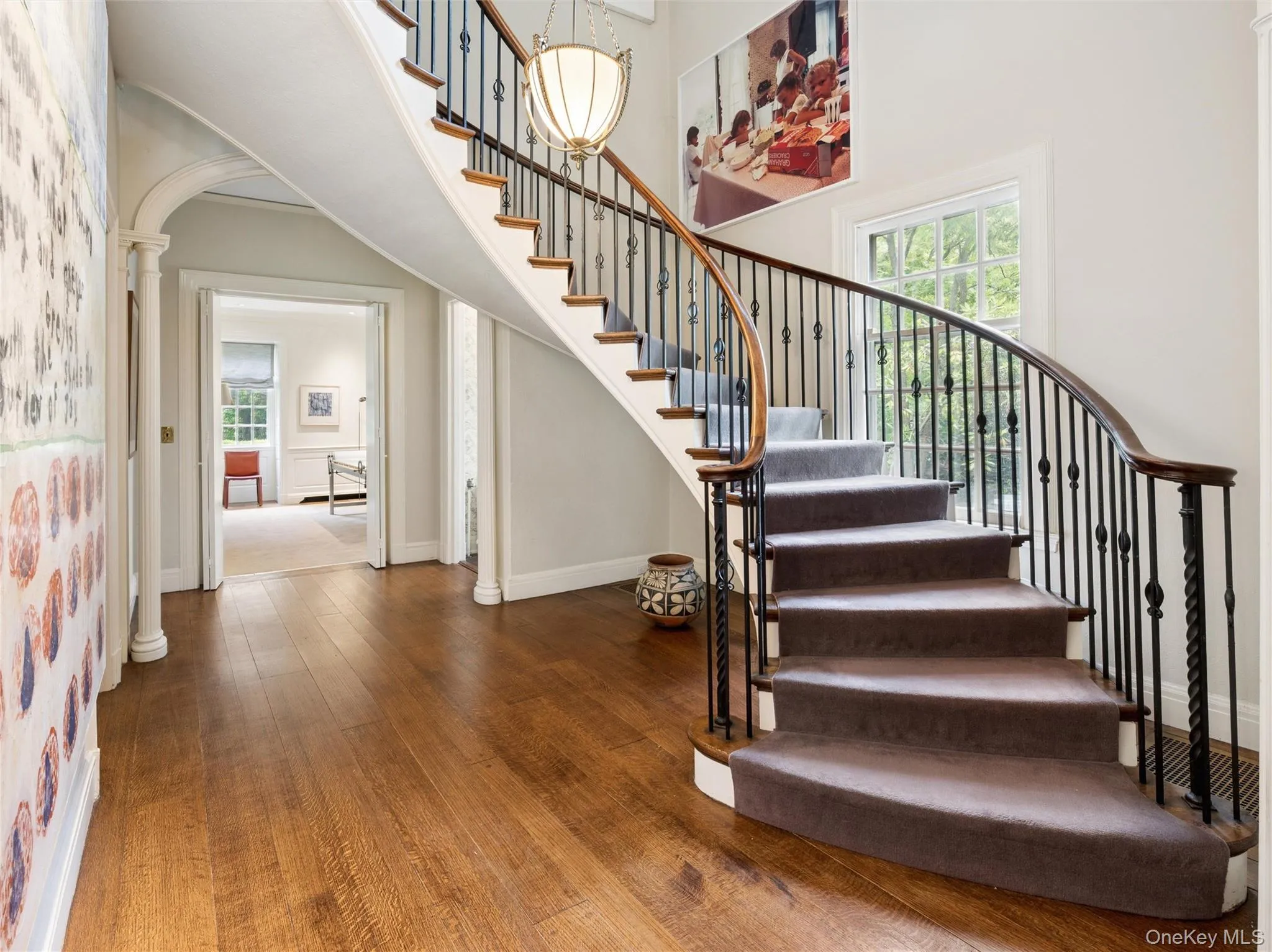 Foyer with sweeping curbed staircase Foyer with sweeping curbed staircase