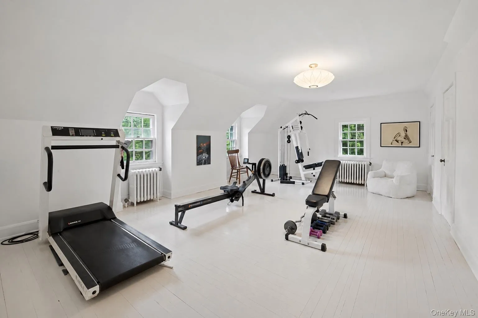 Playroom over 3 car garage currently use as home gym Playroom over 3 car garage currently use as home gym