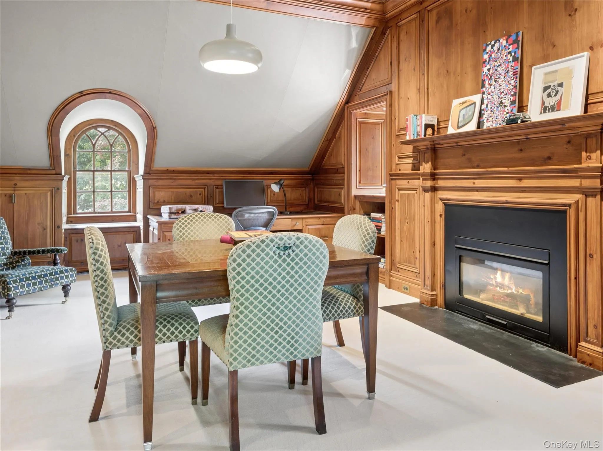 Third floor paneled den with gas fireplace Third floor paneled den with gas fireplace