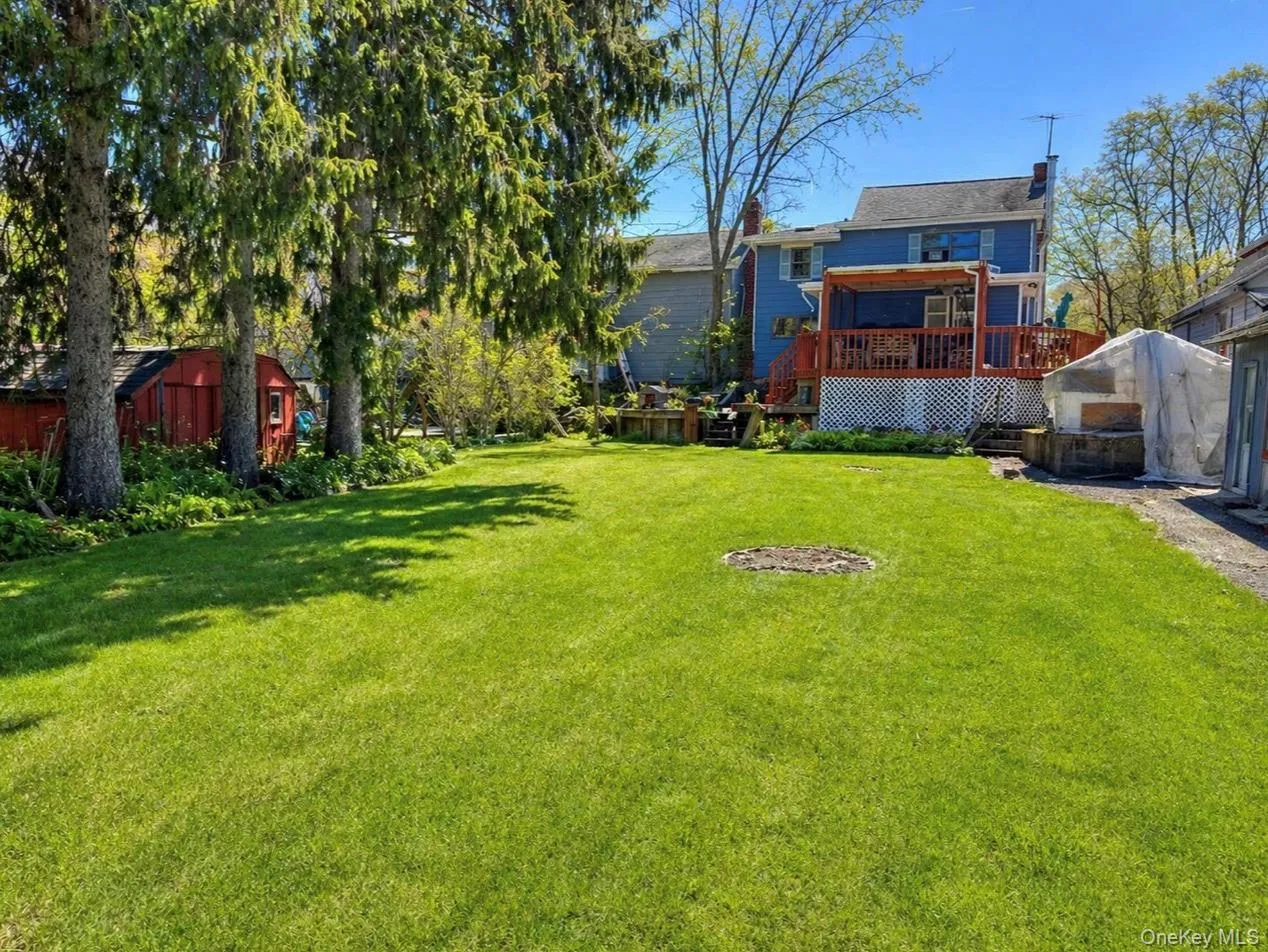 Expansive green lawn providing ample outdoor space Expansive green lawn providing ample outdoor space