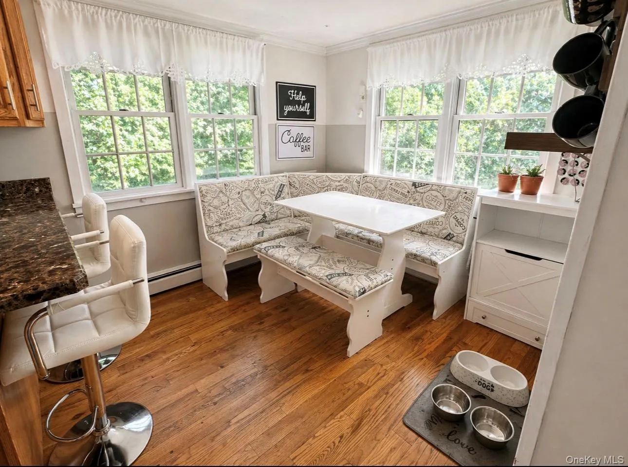 Kitchen nook with abundant natural light from multiple windows Kitchen nook with abundant natural light from multiple windows