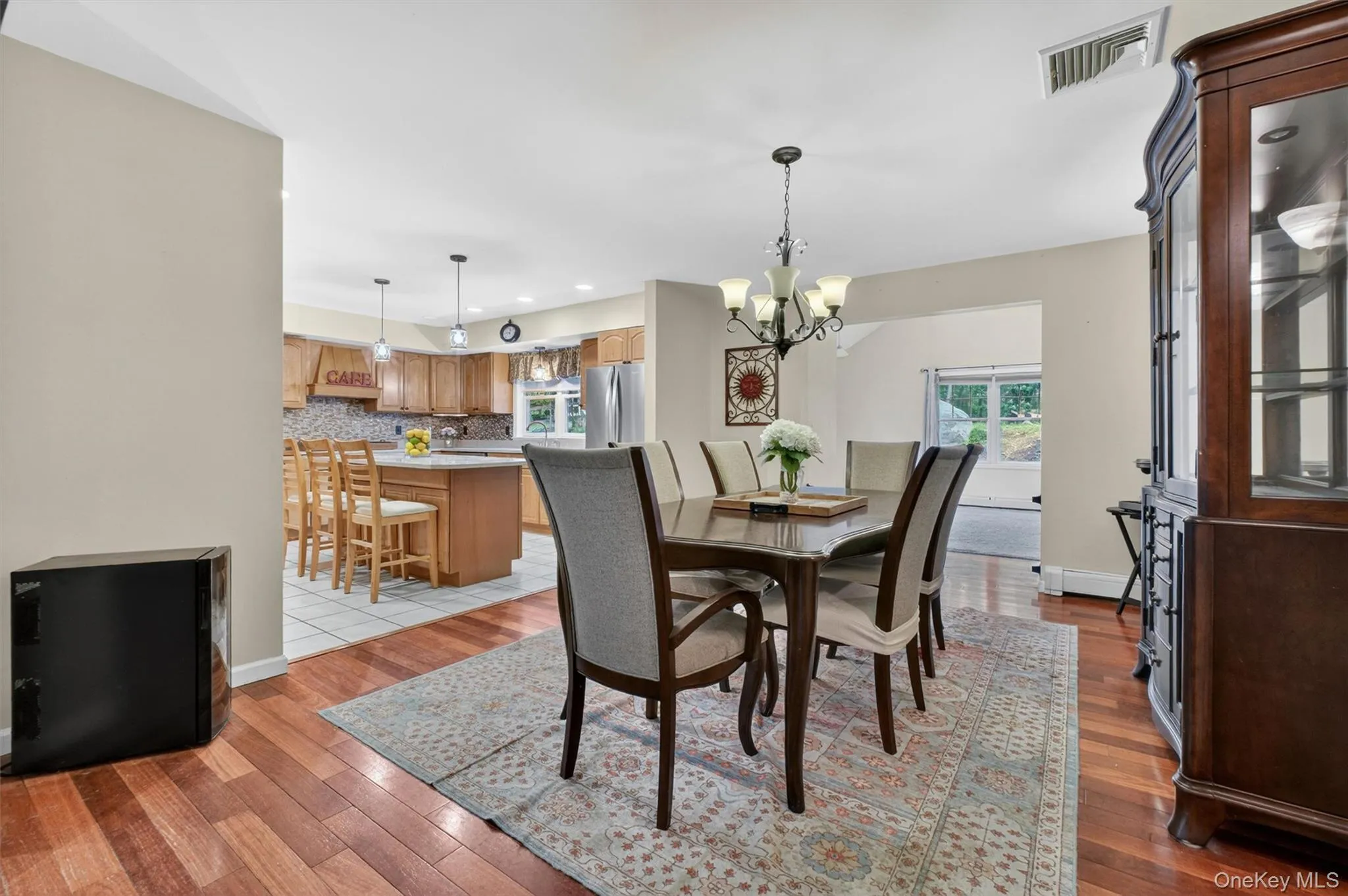Cherry wood floors in main living room and dining room Cherry wood floors in main living room and dining room