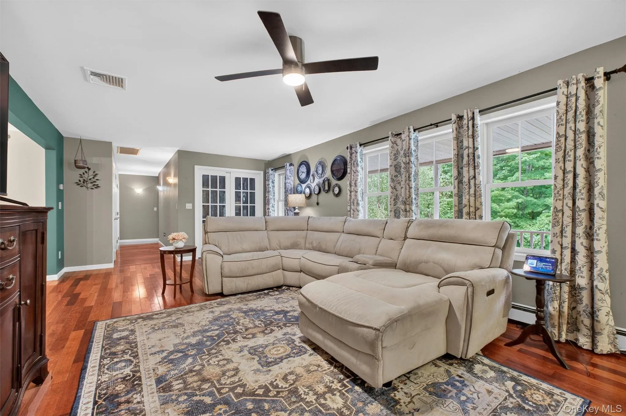 Cherry wood floors in main living room and dining room Cherry wood floors in main living room and dining room