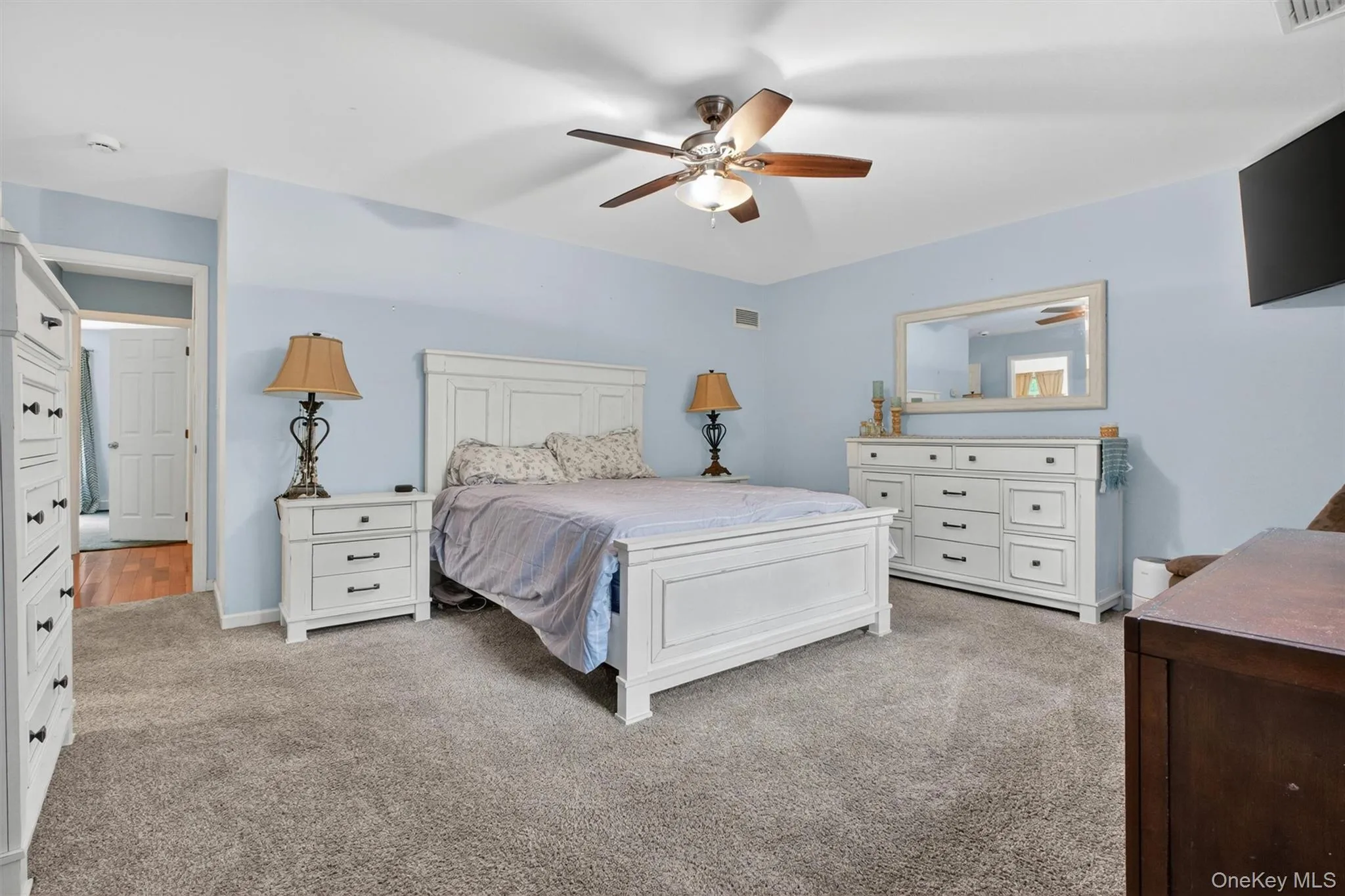 Master bedroom on first floor, wall to wall carpeting Master bedroom on first floor, wall to wall carpeting