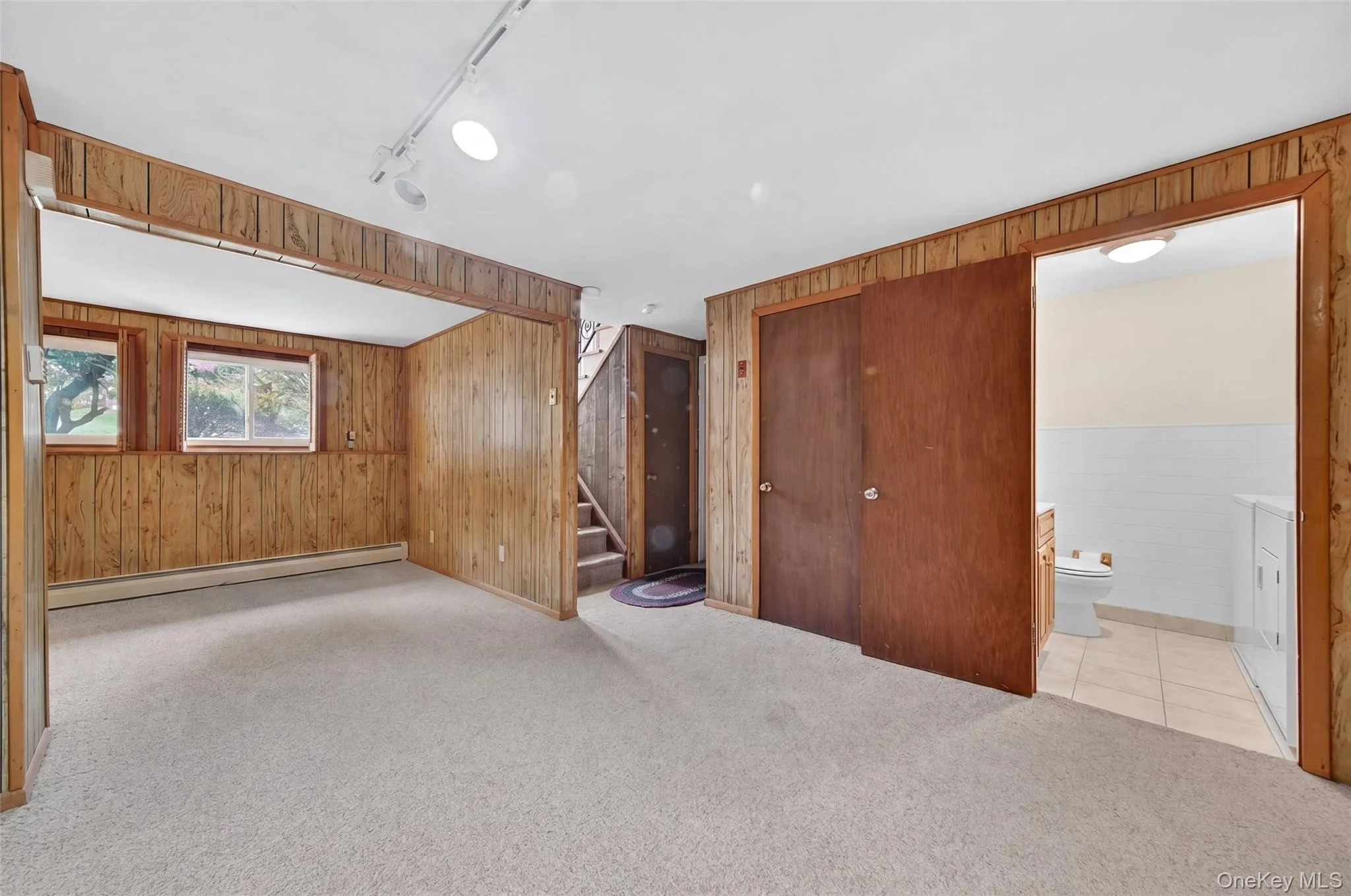 Finished family room and den on lower level Finished family room and den on lower level