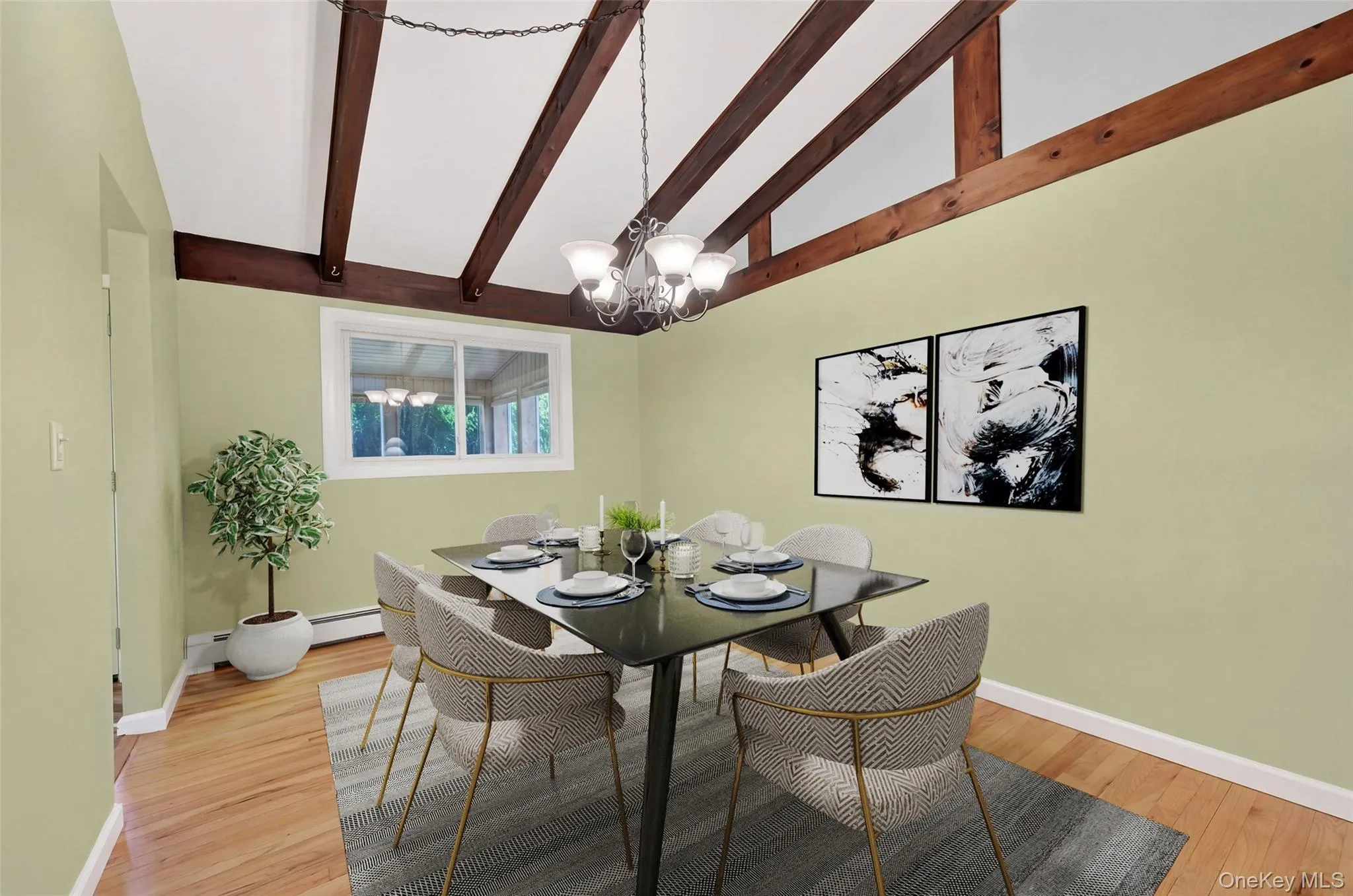 Dining room featuring exposed wood beams, hardwood flooring Dining room featuring exposed wood beams, hardwood flooring