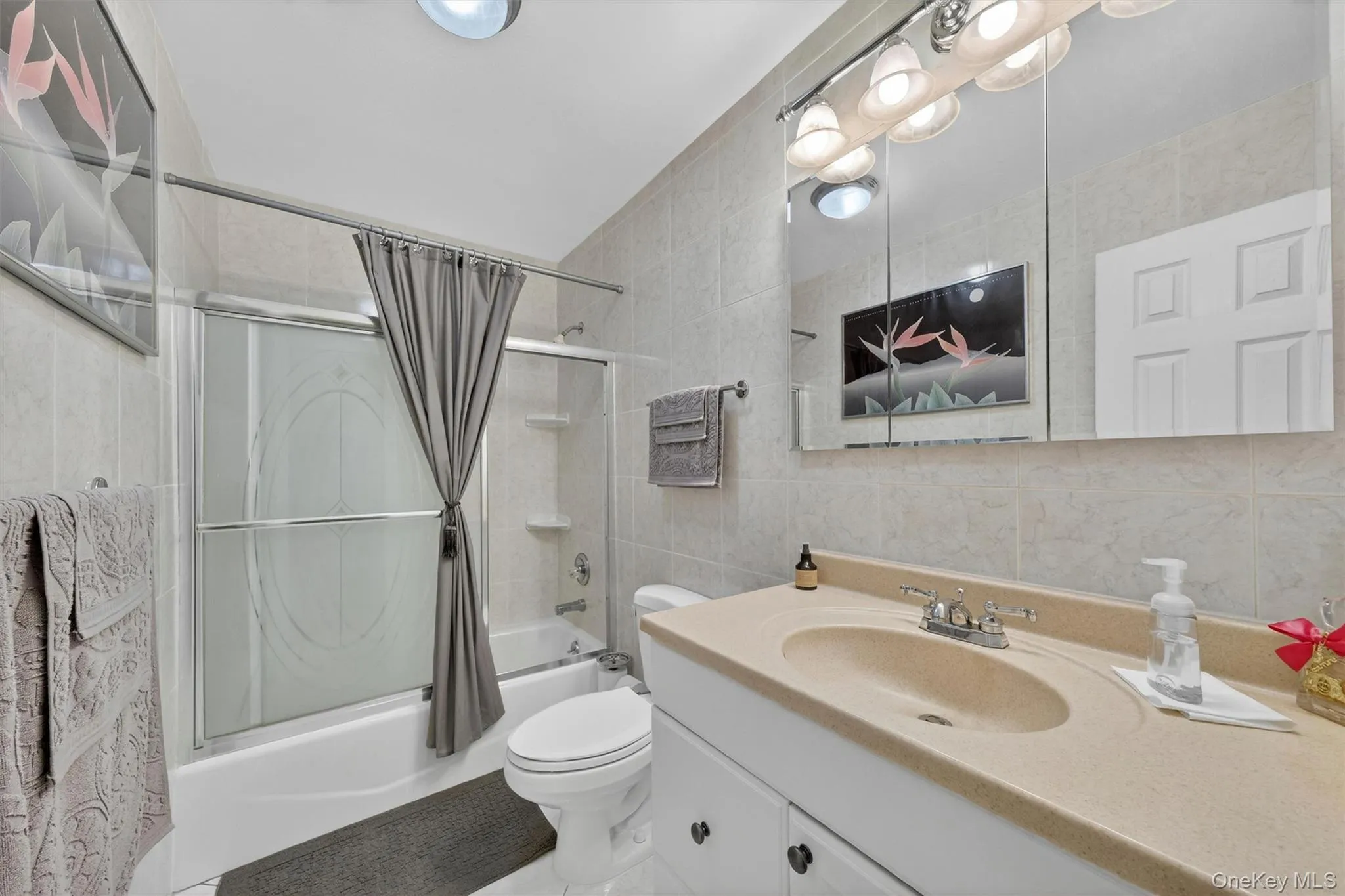 Hall bath with updated tile, fixtures and vanity Hall bath with updated tile, fixtures and vanity