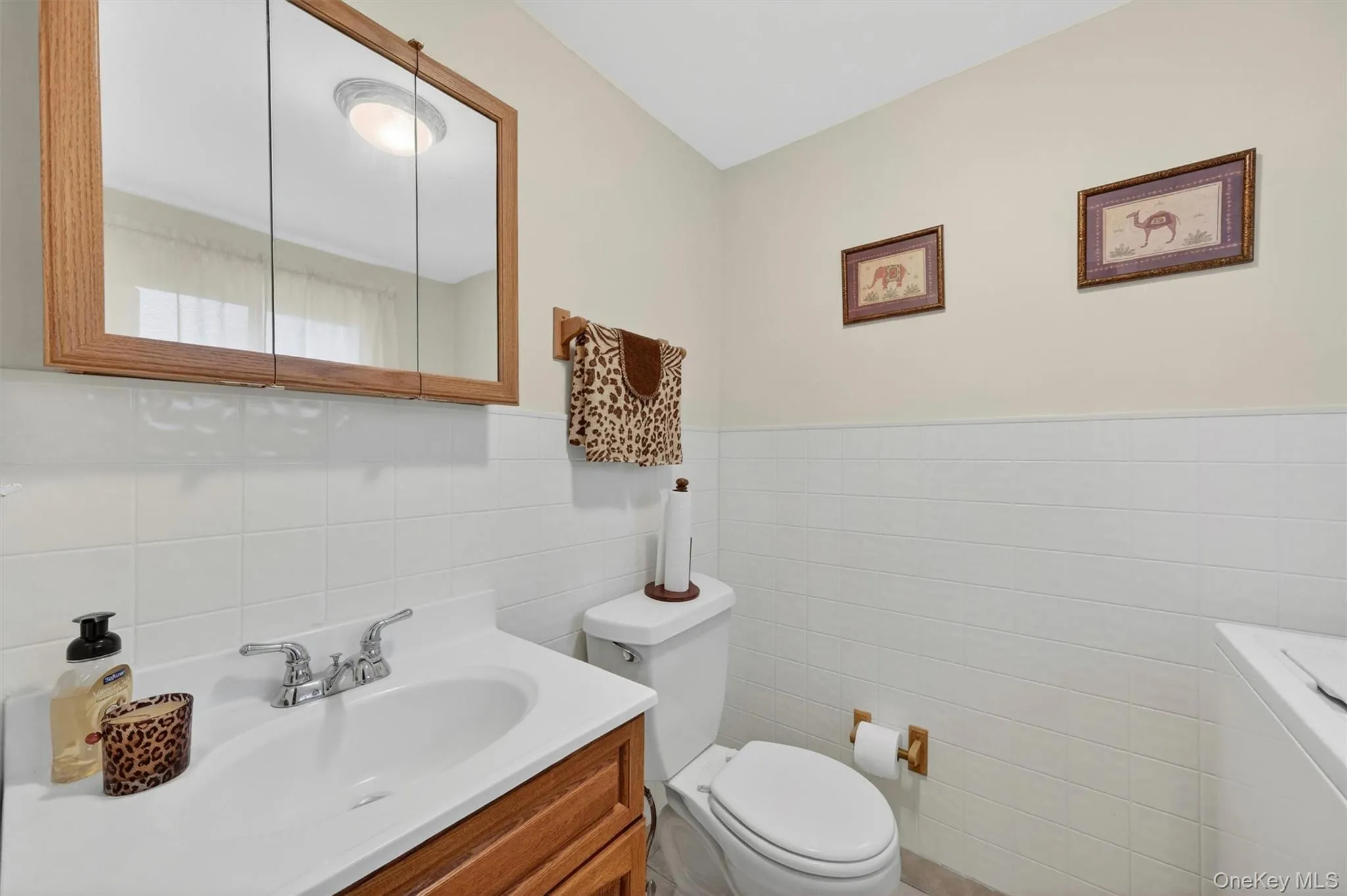 Hall bath with updated tile, fixtures and vanity Hall bath with updated tile, fixtures and vanity
