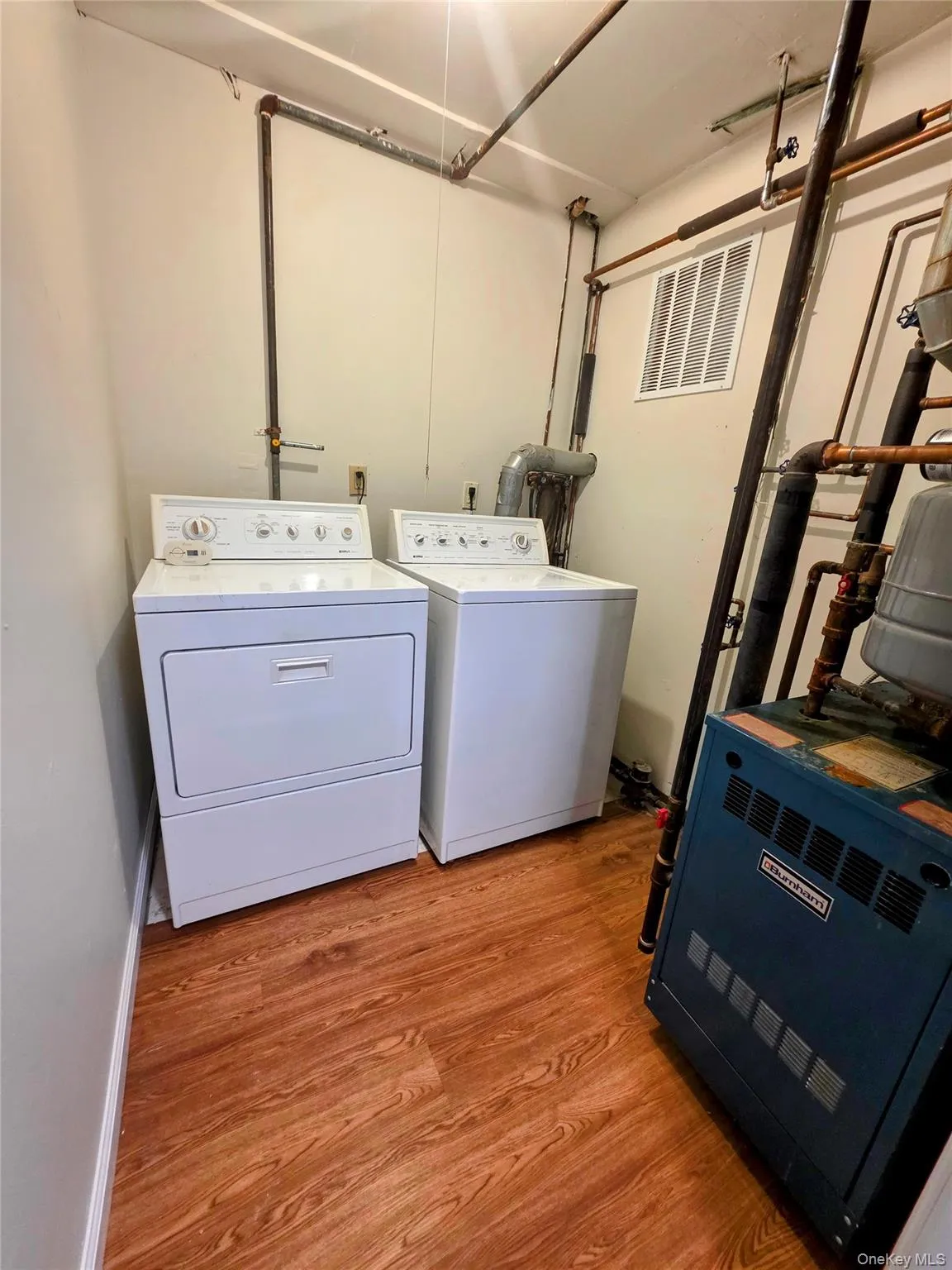 Laundry Room with gas dryer hookup. Burnham gas furnace. Laundry Room with gas dryer hookup. Burnham gas furnace.