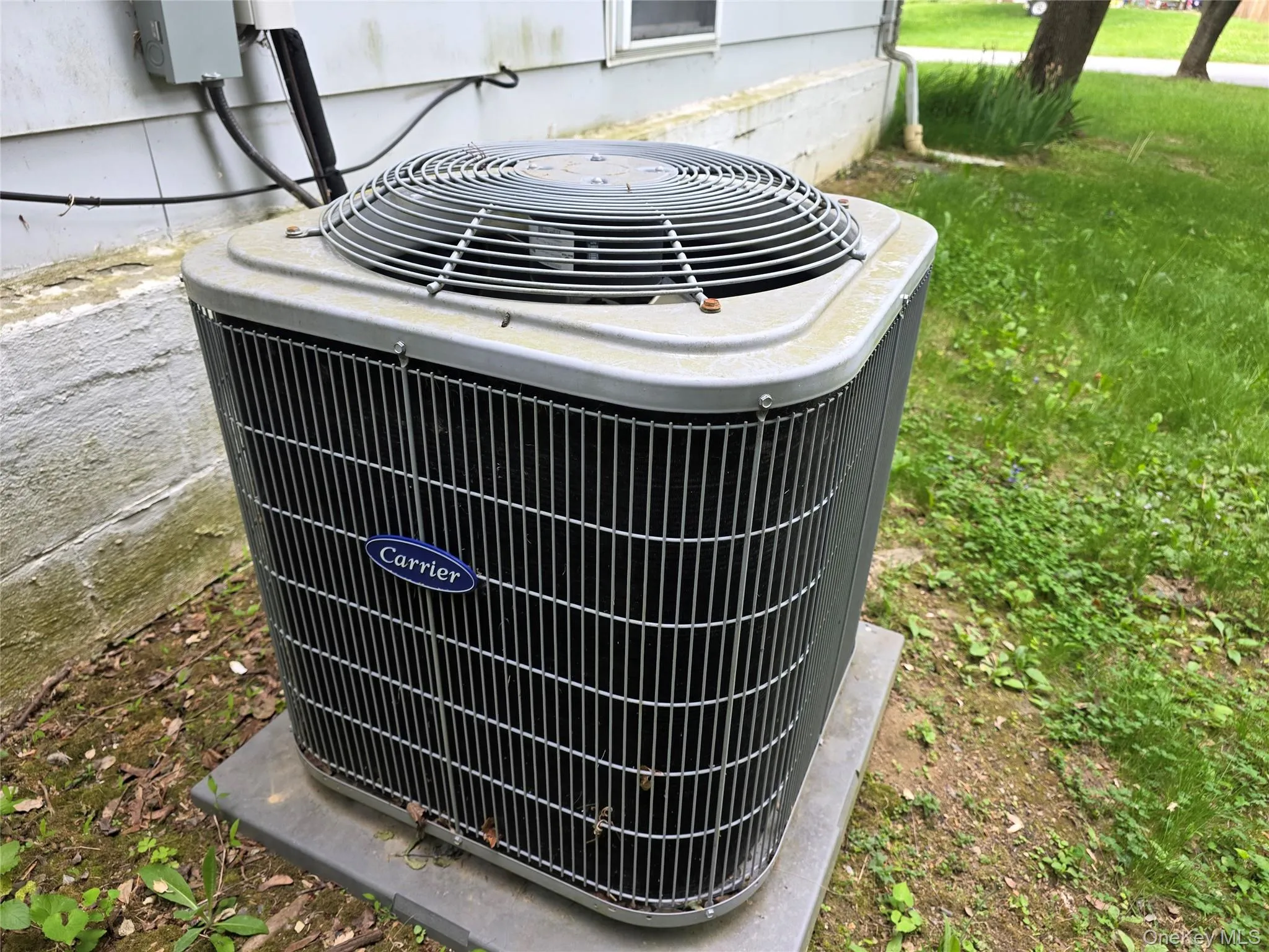 Carrier-Central-air unit cools main level. Carrier-Central-air unit cools main level.