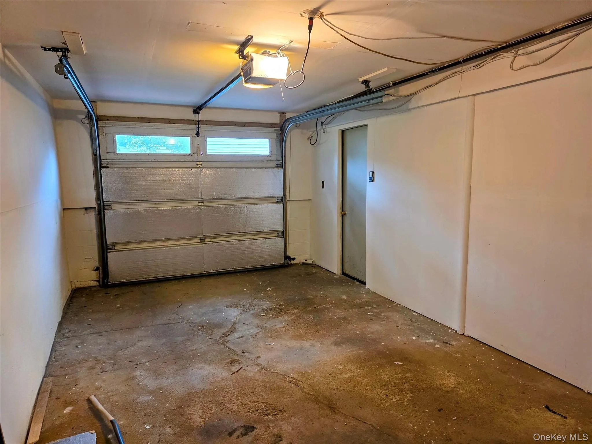 Garage door opener with interior access to house. Garage door opener with interior access to house.