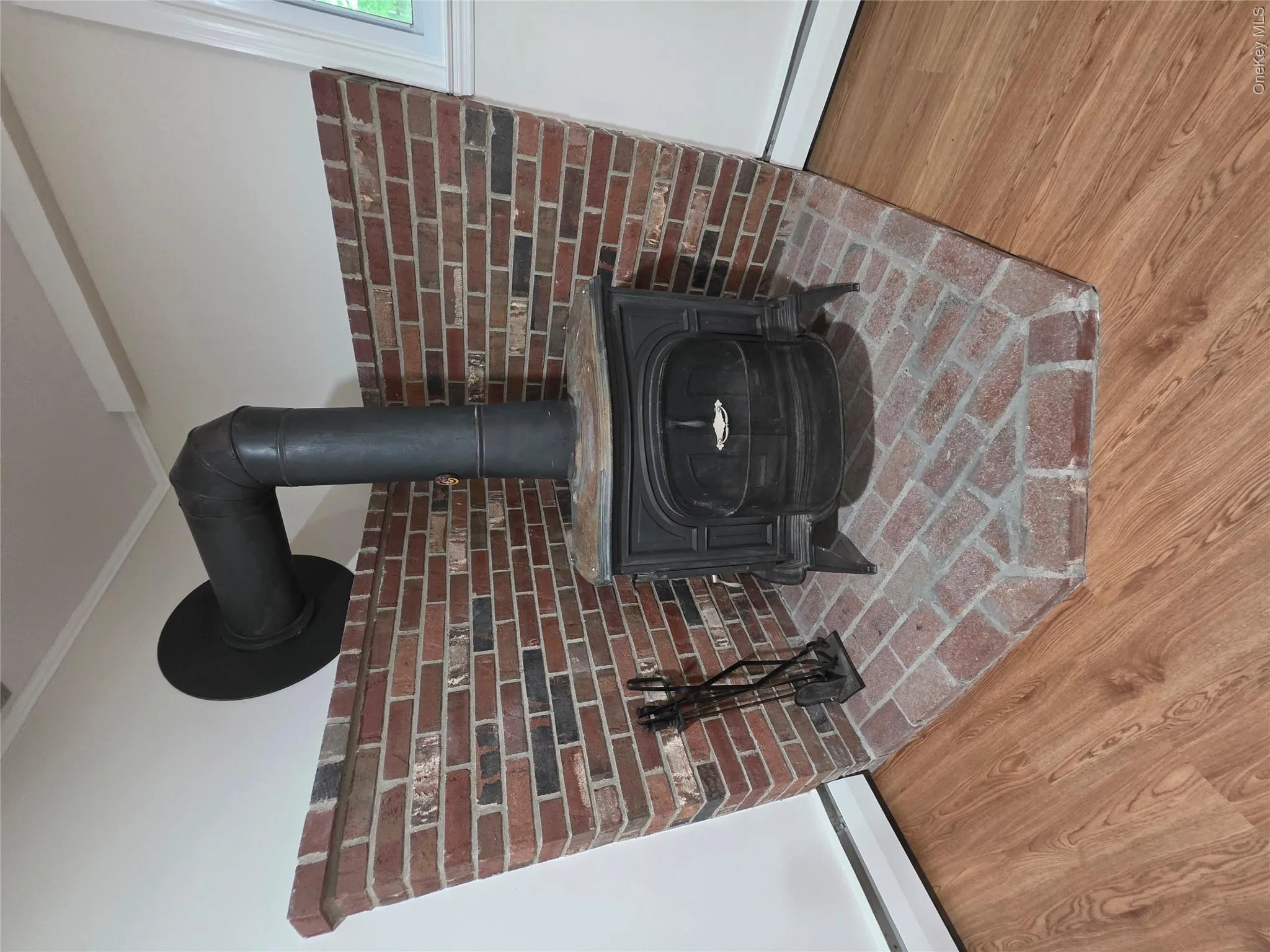 Vermont Castings-Defiant model wood stove with brick hearth. Vermont Castings-Defiant model wood stove with brick hearth.