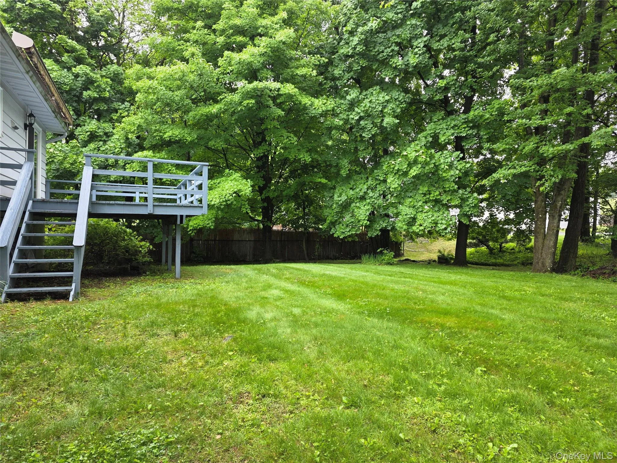 Nice flat backyard-view from end of driveway. Nice flat backyard-view from end of driveway.