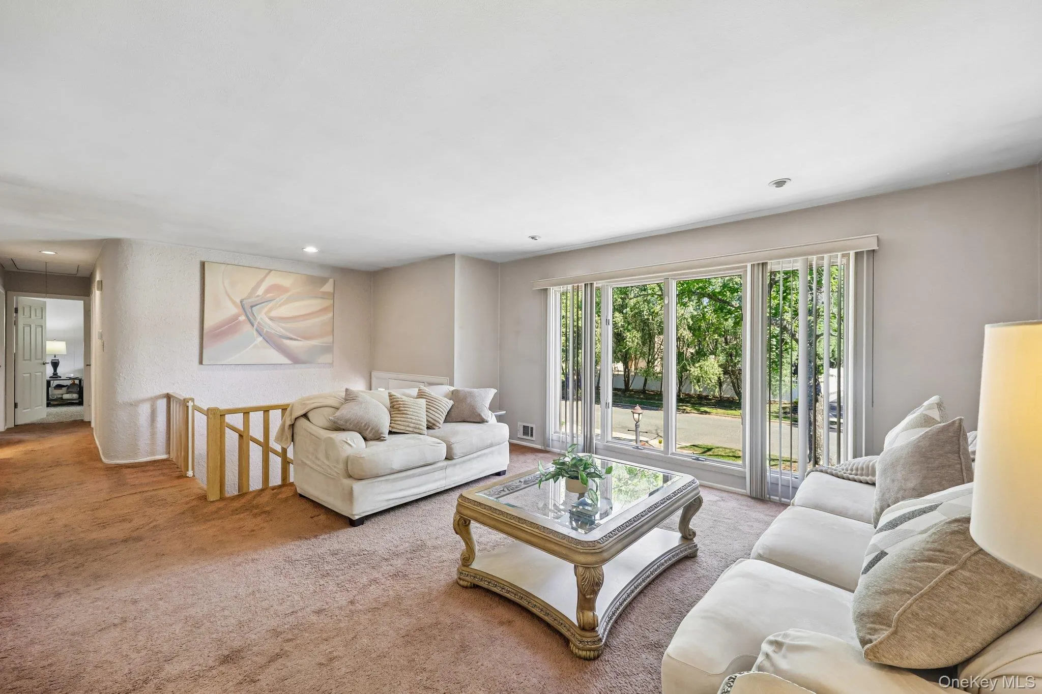 Large open Living room featuring large to floor panel windows Large open Living room featuring large to floor panel windows