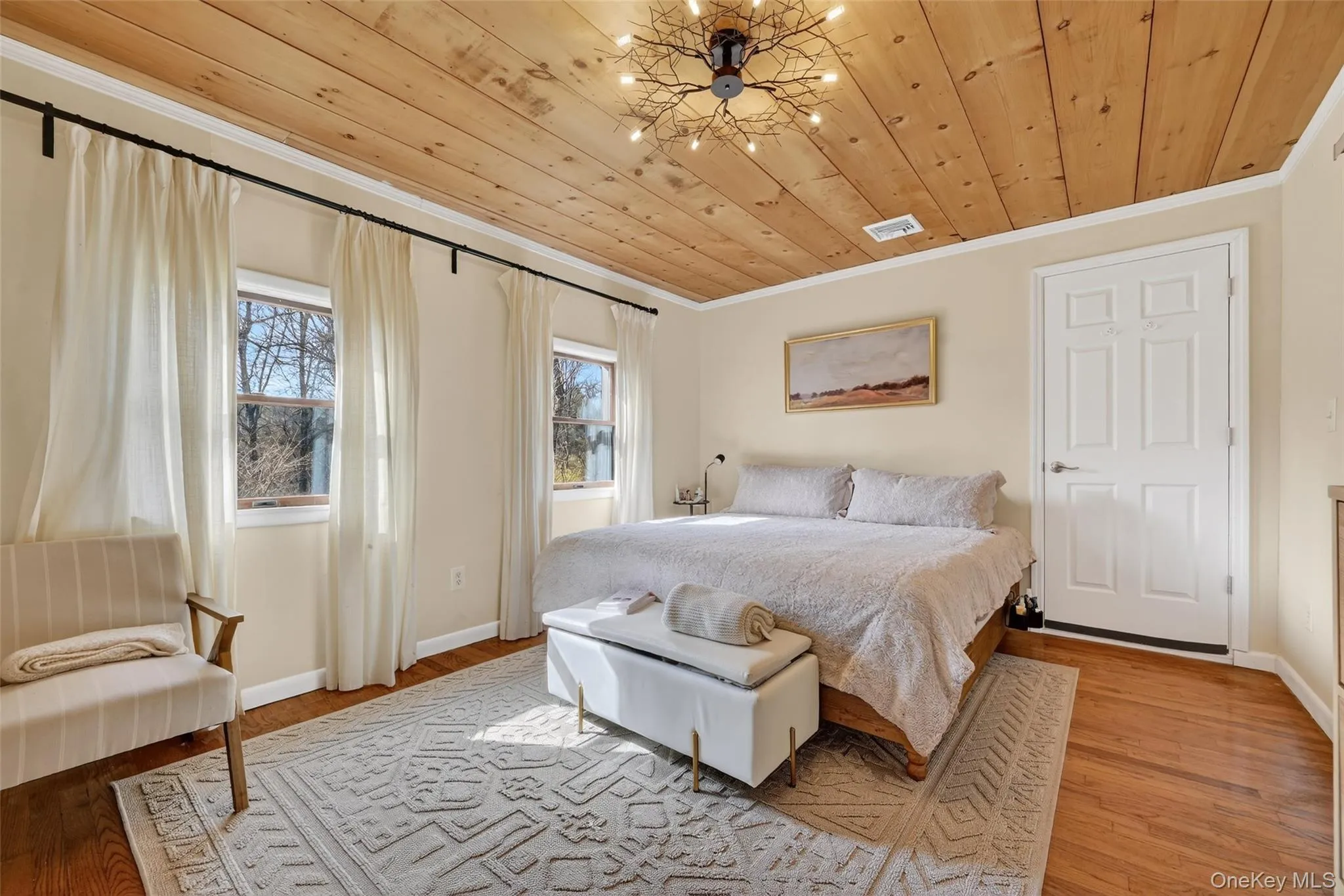 Hardwood flooring complemented by a detailed area rug Hardwood flooring complemented by a detailed area rug